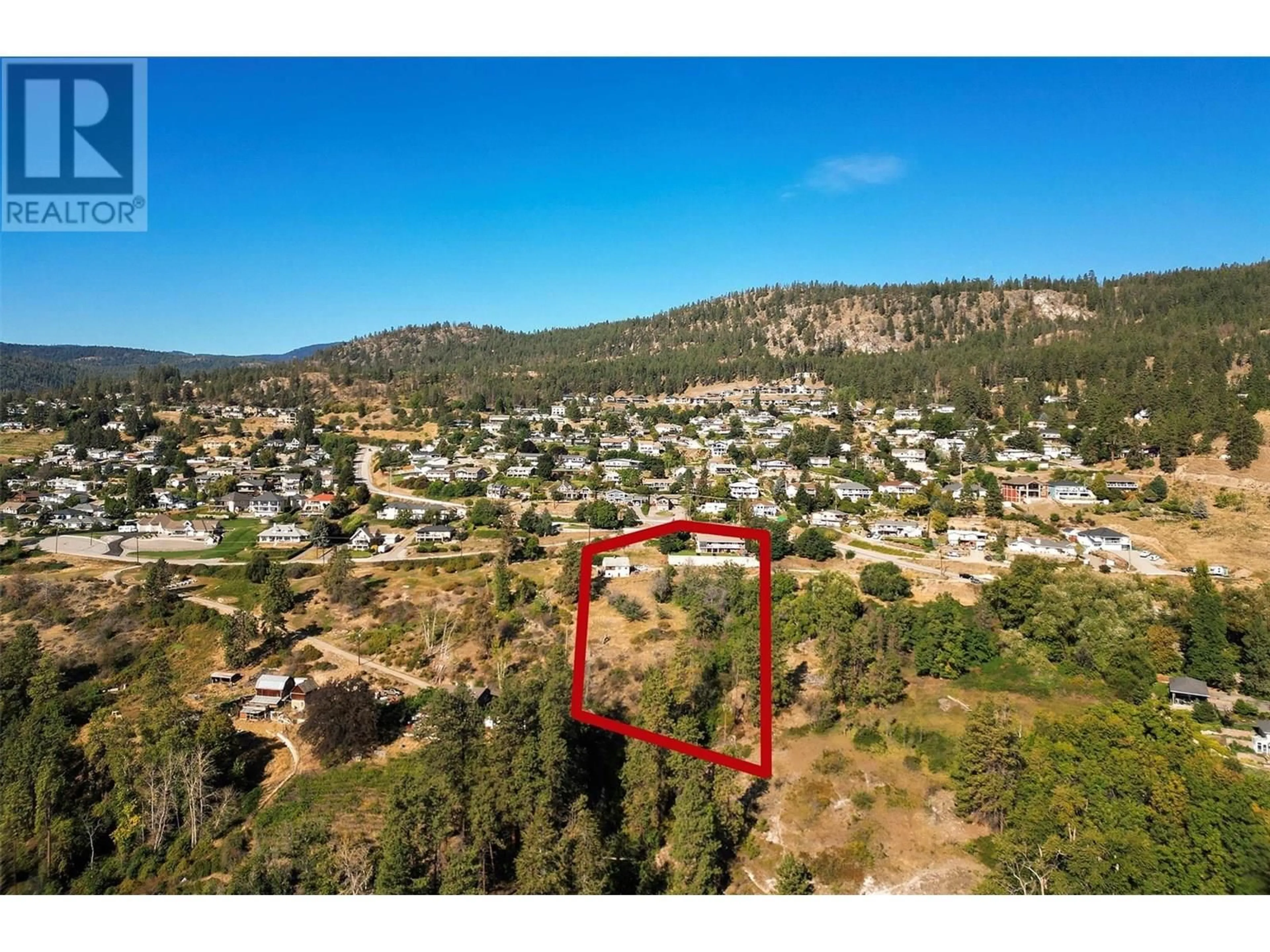 A pic from outside/outdoor area/front of a property/back of a property/a pic from drone, mountain view for 4649 PRINCETON AVENUE, Peachland British Columbia V0H1X7
