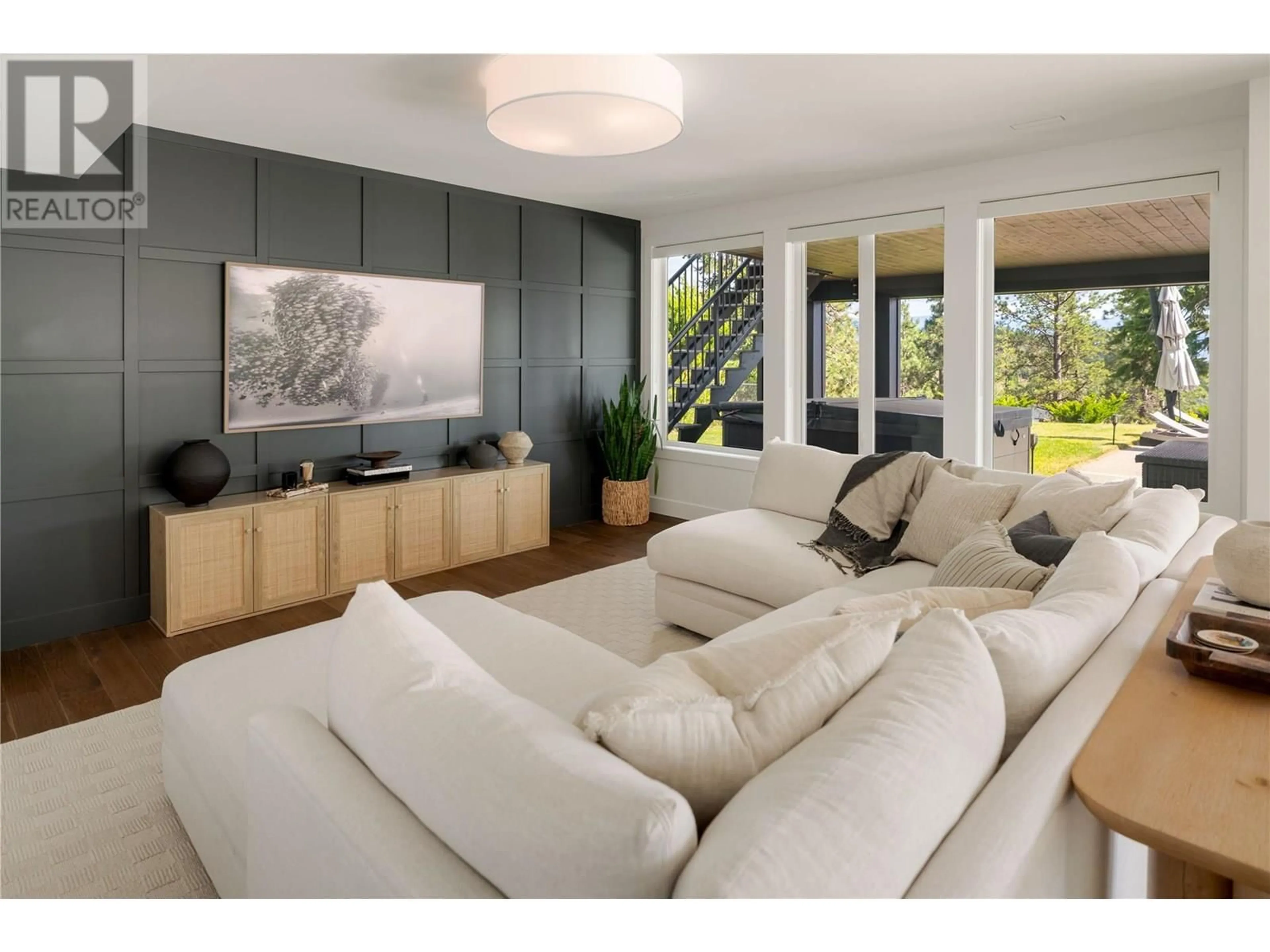 Living room with furniture, wood/laminate floor for 172 SKYLAND DRIVE, Kelowna British Columbia V1V3A1