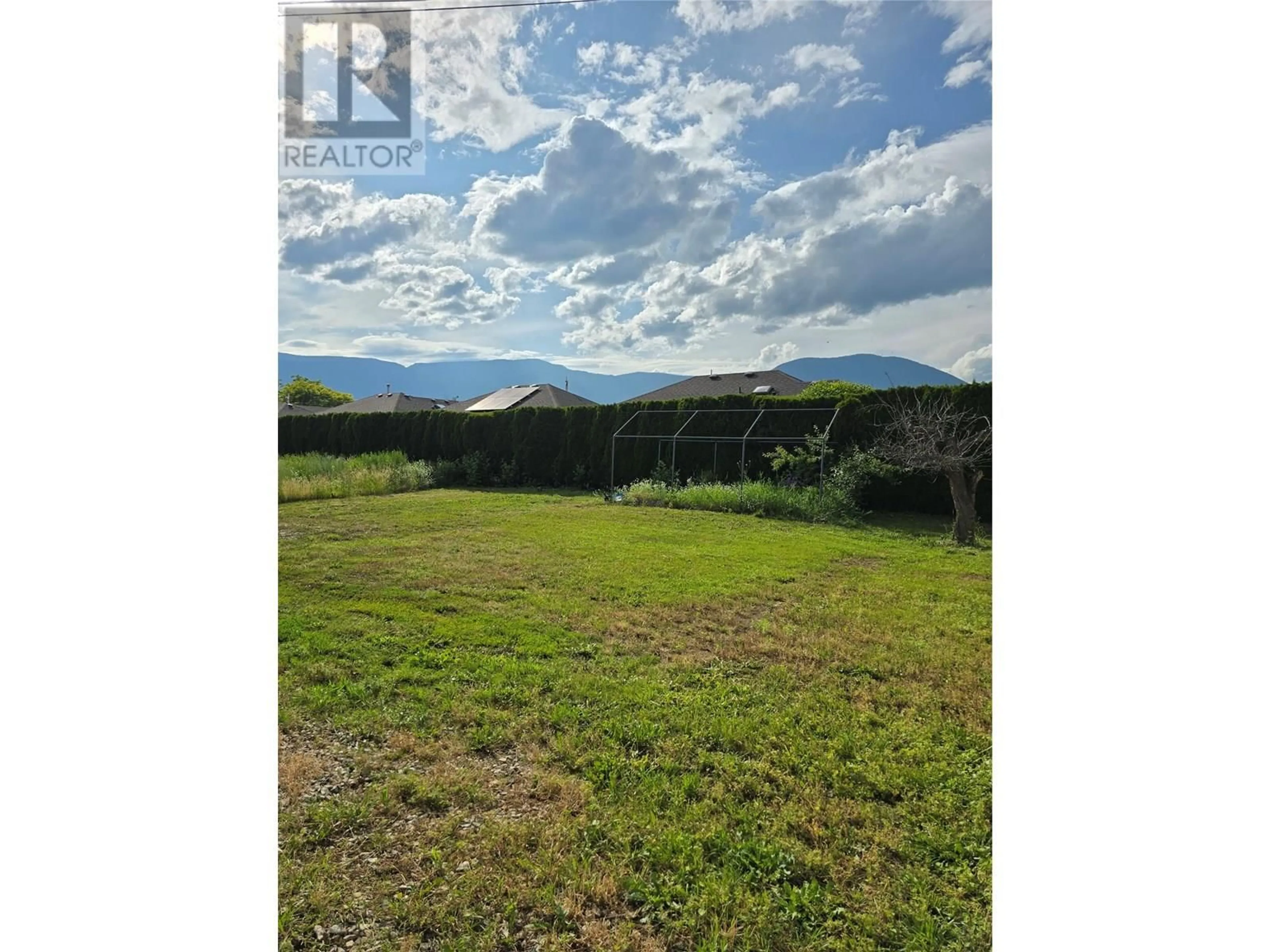 A pic from outside/outdoor area/front of a property/back of a property/a pic from drone, mountain view for 221 BEATTY AVENUE NORTHWEST, Salmon Arm British Columbia V1E4M9
