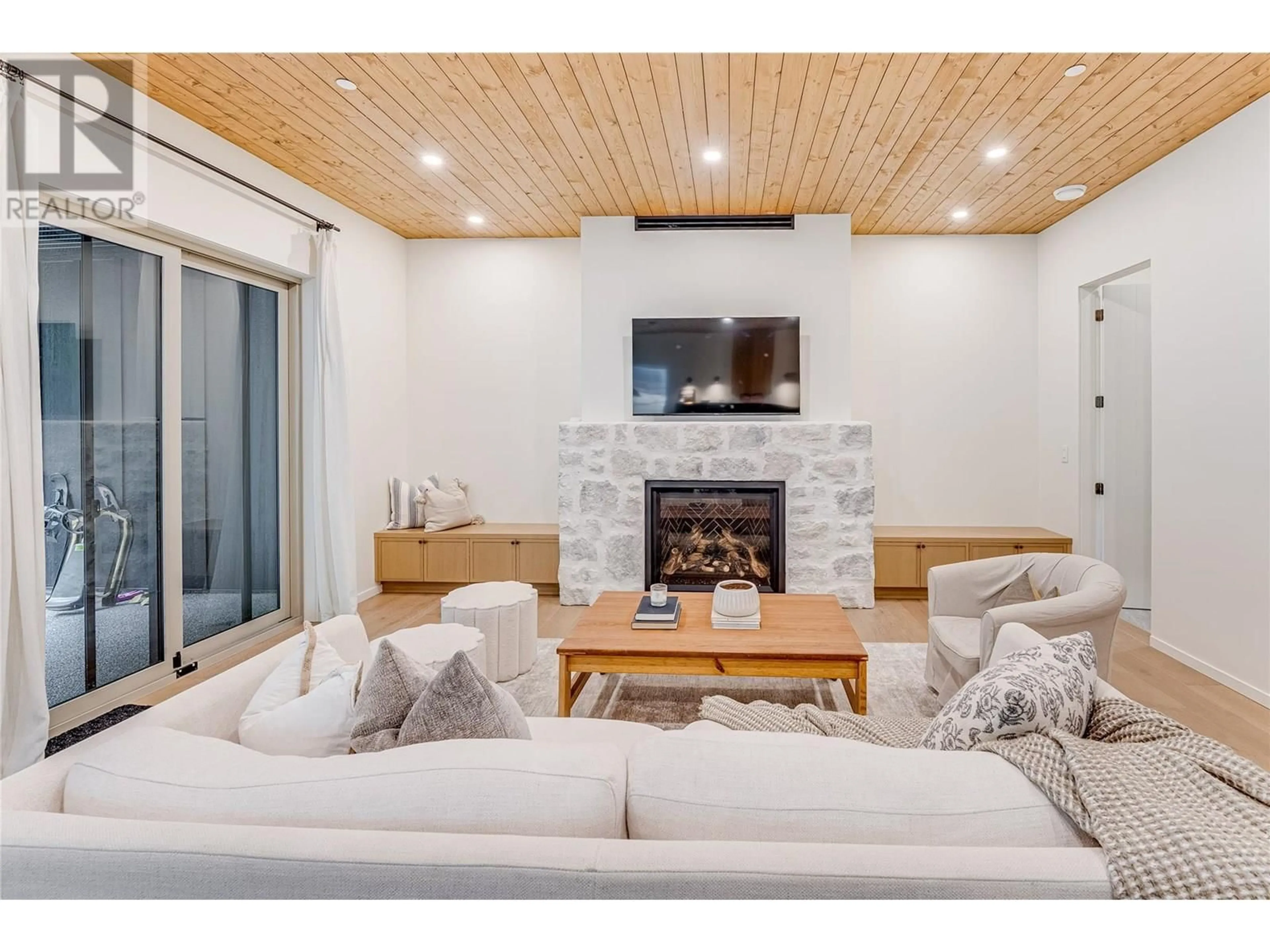 Living room with furniture, wood/laminate floor for 9963 PURCELL DRIVE, Vernon British Columbia V1B3M1