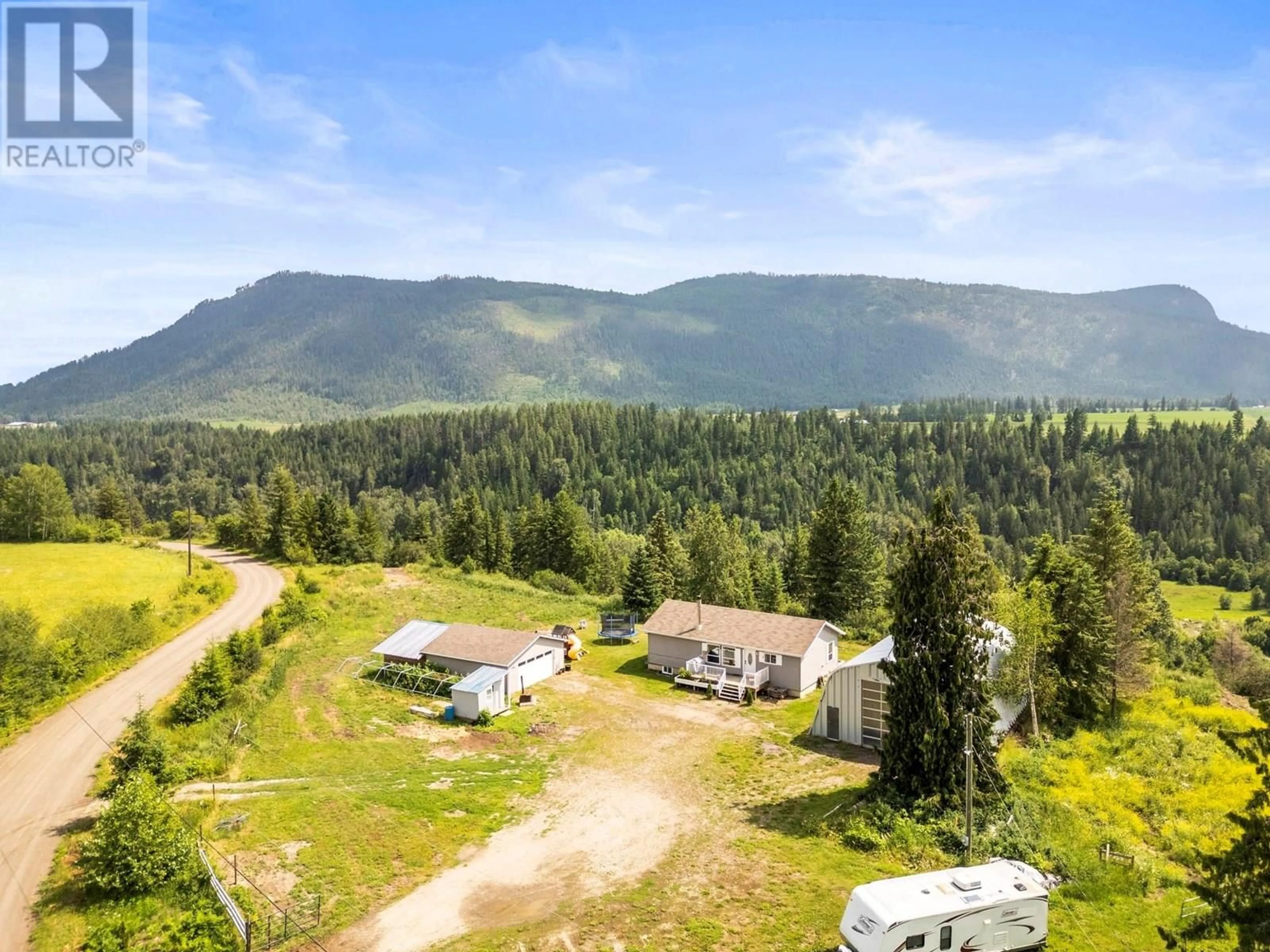 A pic from outside/outdoor area/front of a property/back of a property/a pic from drone, mountain view for 496 ALBERS ROAD, Lumby British Columbia V0E2G5