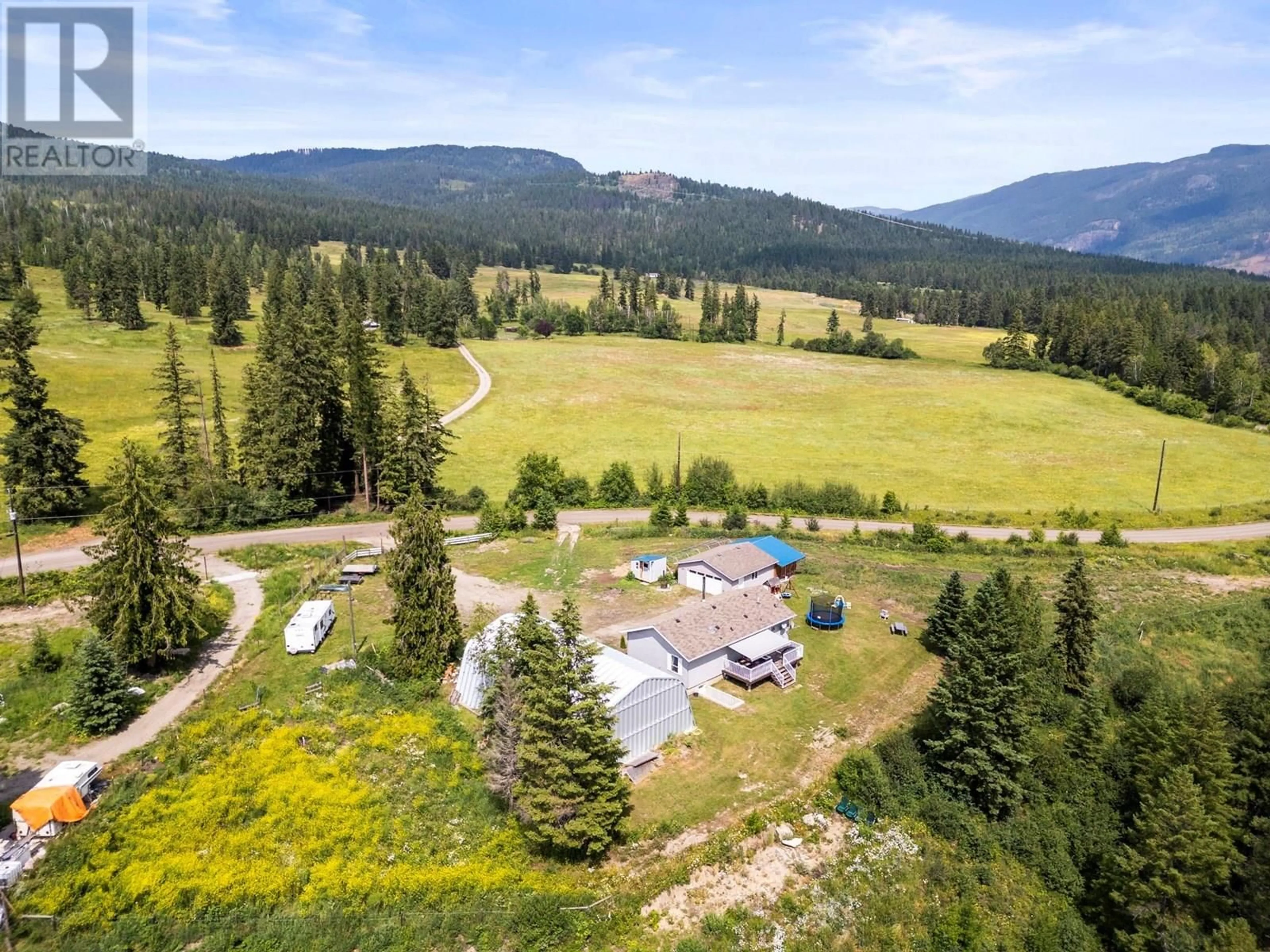 A pic from outside/outdoor area/front of a property/back of a property/a pic from drone, mountain view for 496 ALBERS ROAD, Lumby British Columbia V0E2G5