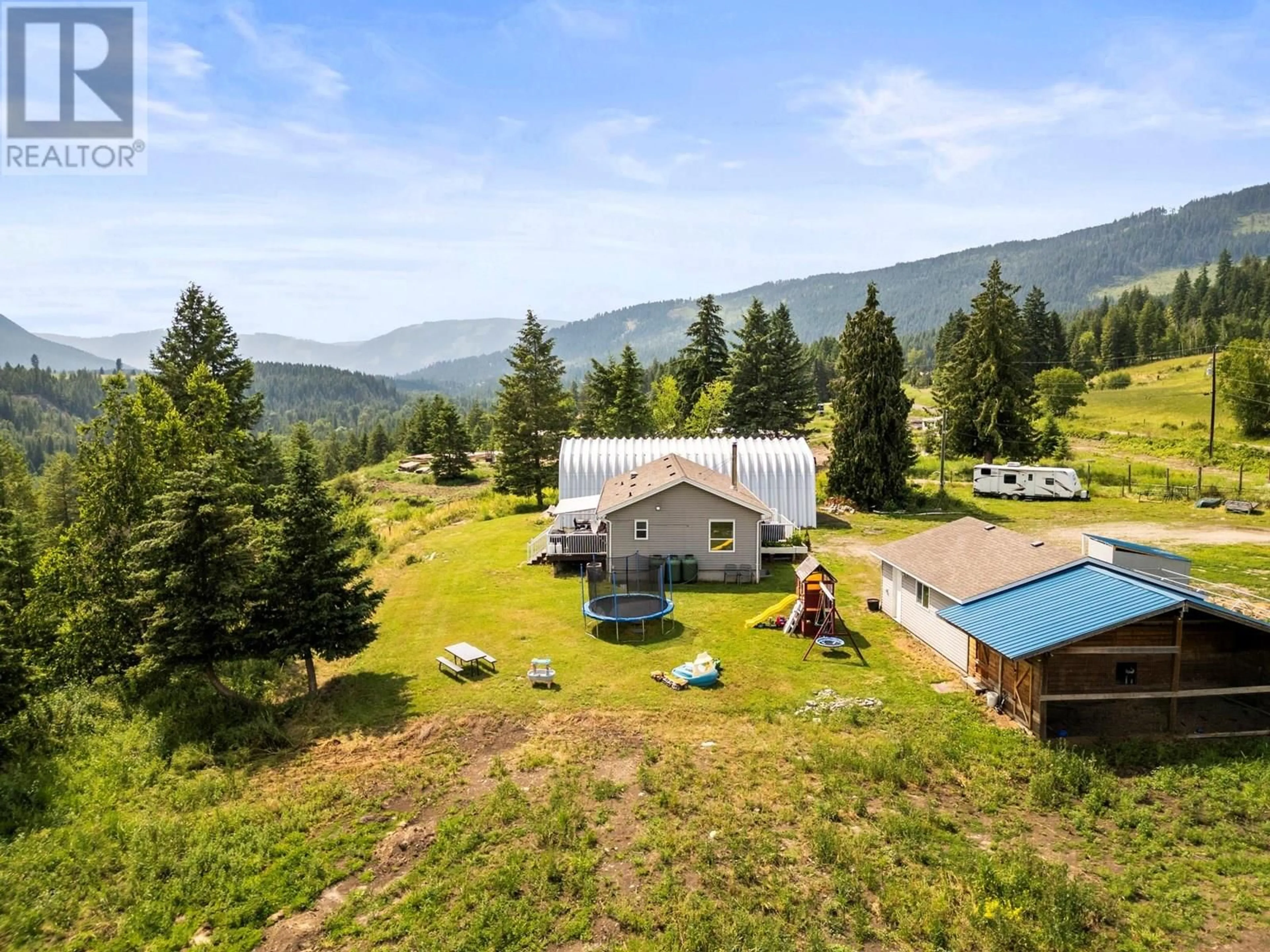 A pic from outside/outdoor area/front of a property/back of a property/a pic from drone, mountain view for 496 ALBERS ROAD, Lumby British Columbia V0E2G5