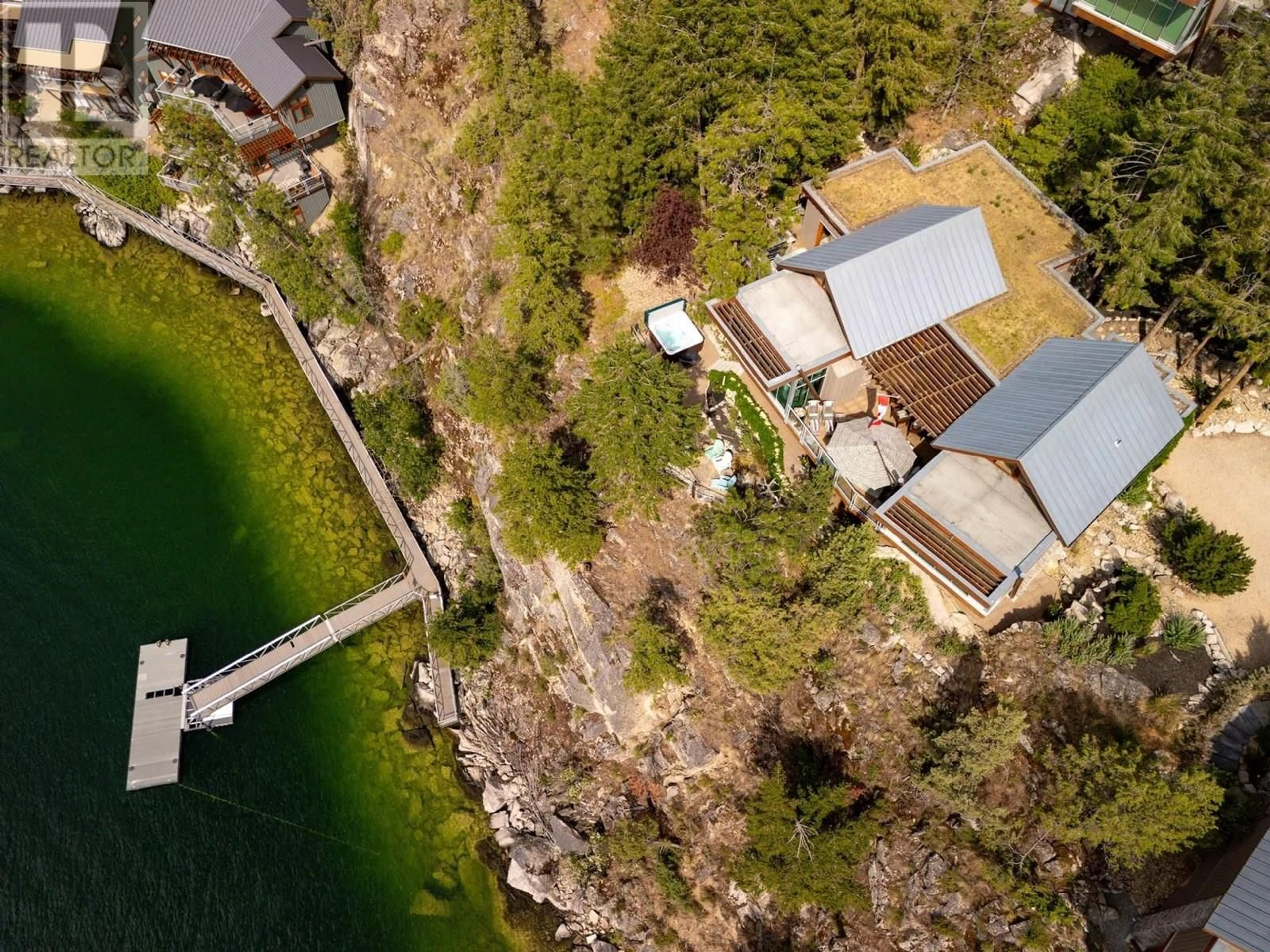A pic from outside/outdoor area/front of a property/back of a property/a pic from drone, water/lake/river/ocean view for 125 & 126 - 9845 EASTSIDE ROAD, Vernon British Columbia V1H1Z2
