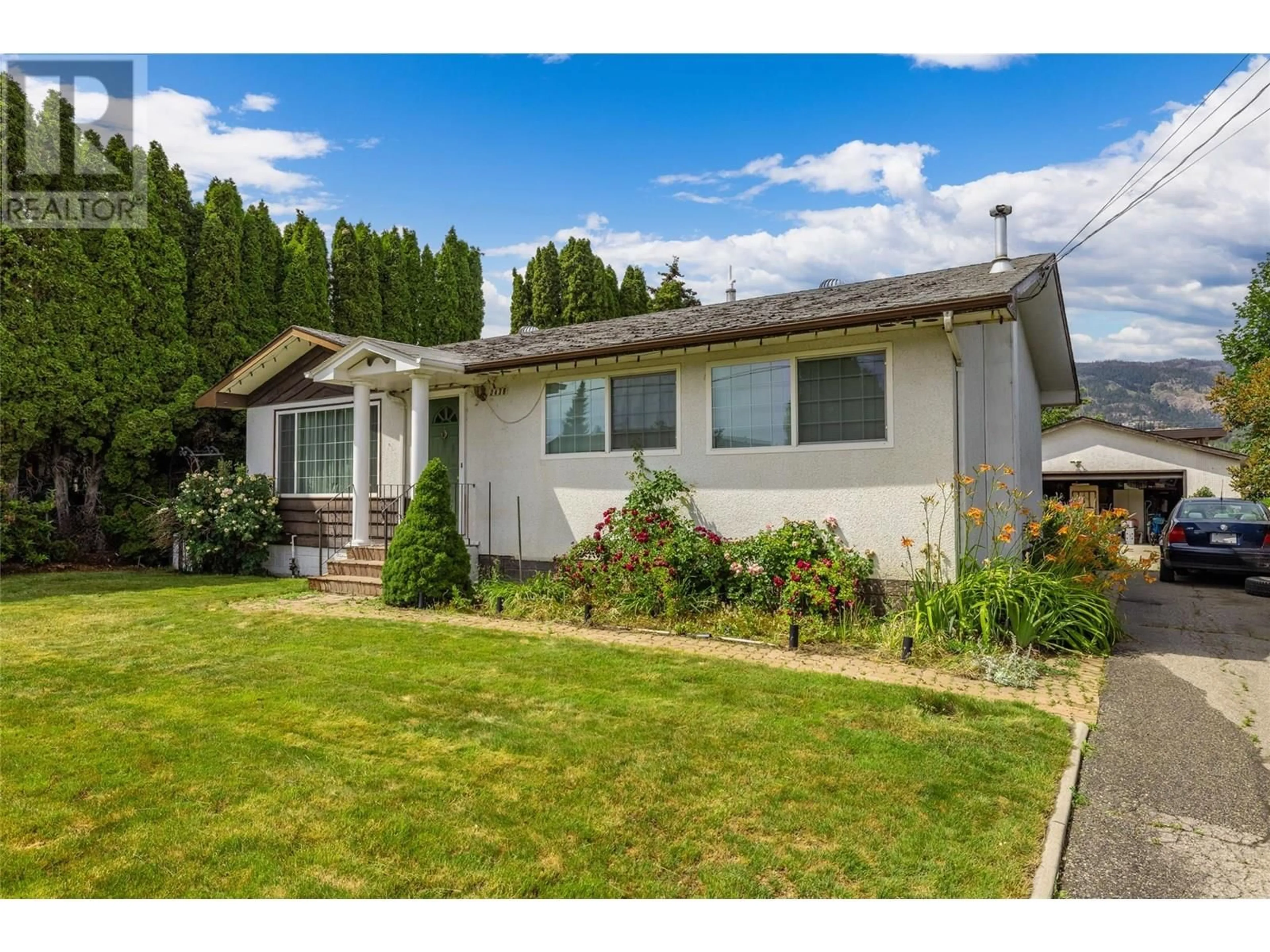 Home with vinyl exterior material, street for 2436 APOLLO ROAD, West Kelowna British Columbia V4T1P7