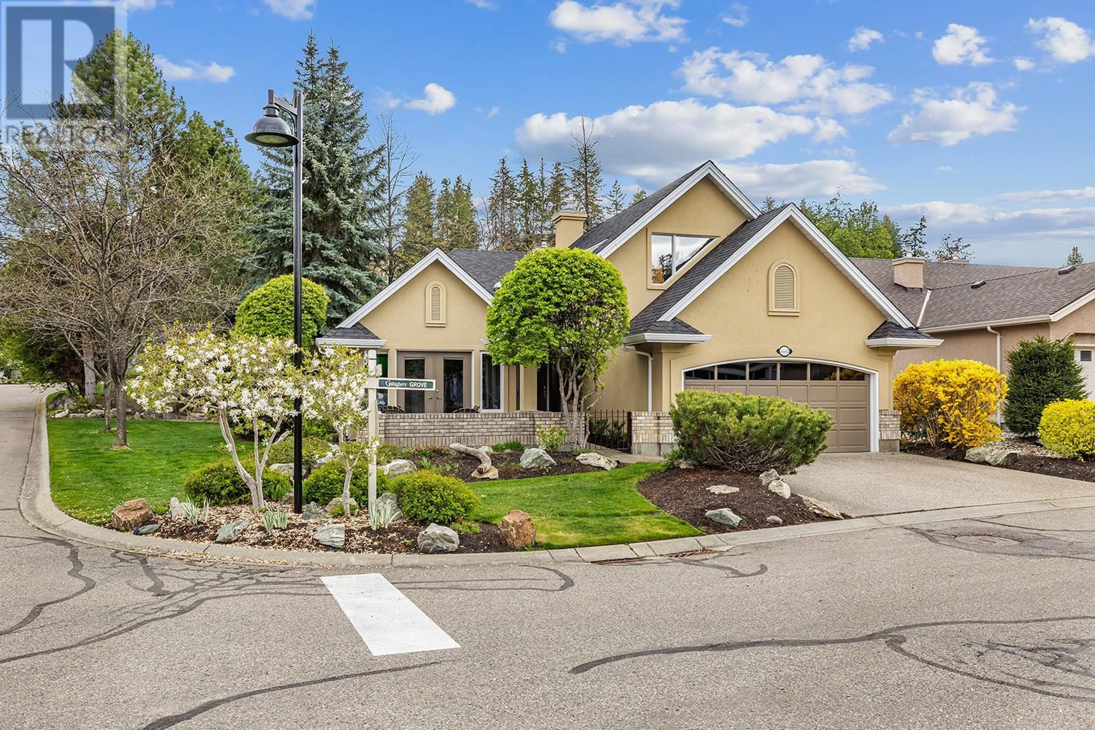 A pic from outside/outdoor area/front of a property/back of a property/a pic from drone, street for 4182 GALLAGHERS GROVE, Kelowna British Columbia V1W3Z9