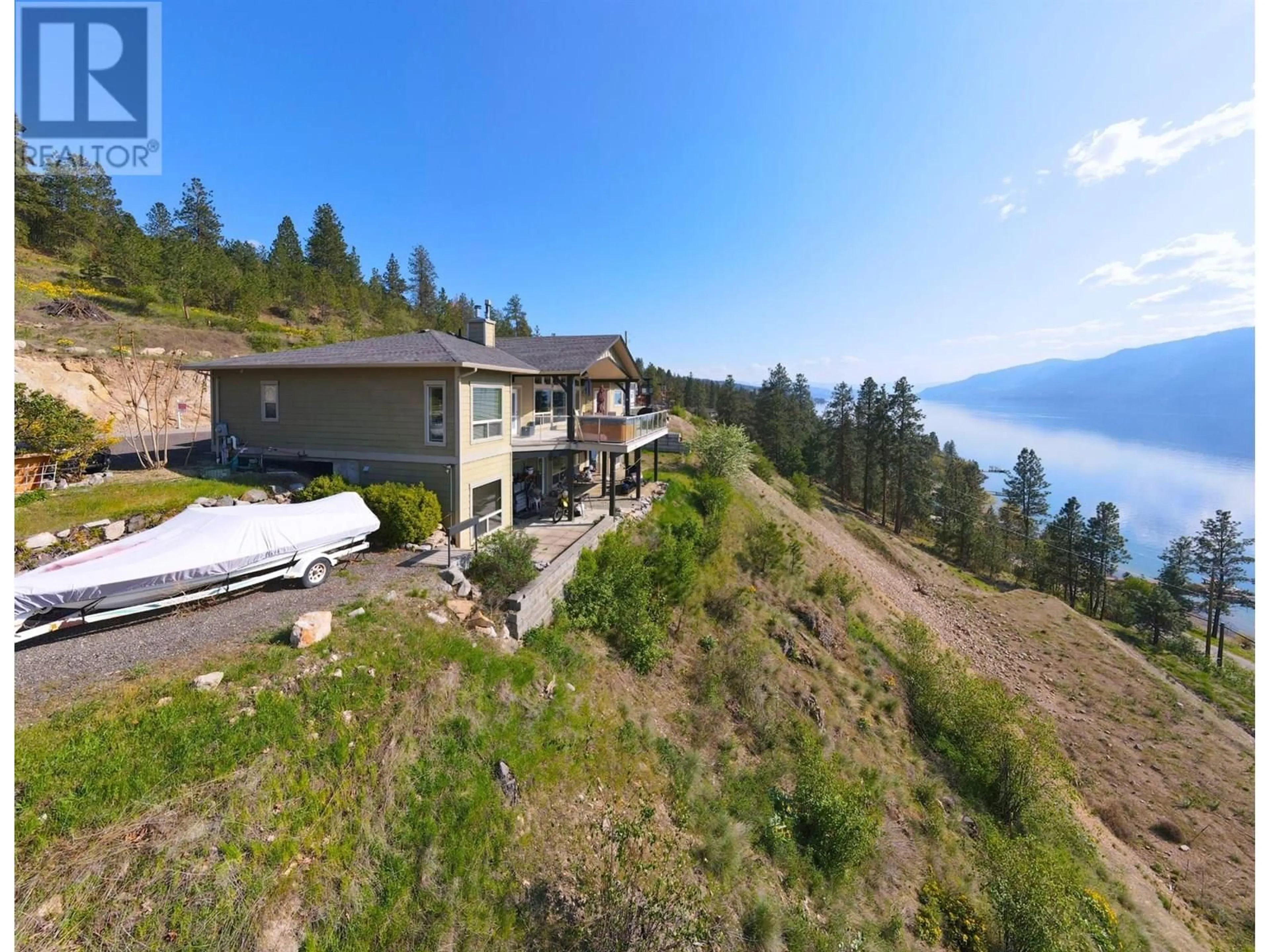 A pic from outside/outdoor area/front of a property/back of a property/a pic from drone, water/lake/river/ocean view for 13938 MOBERLY ROAD, Lake Country British Columbia V4V1A6