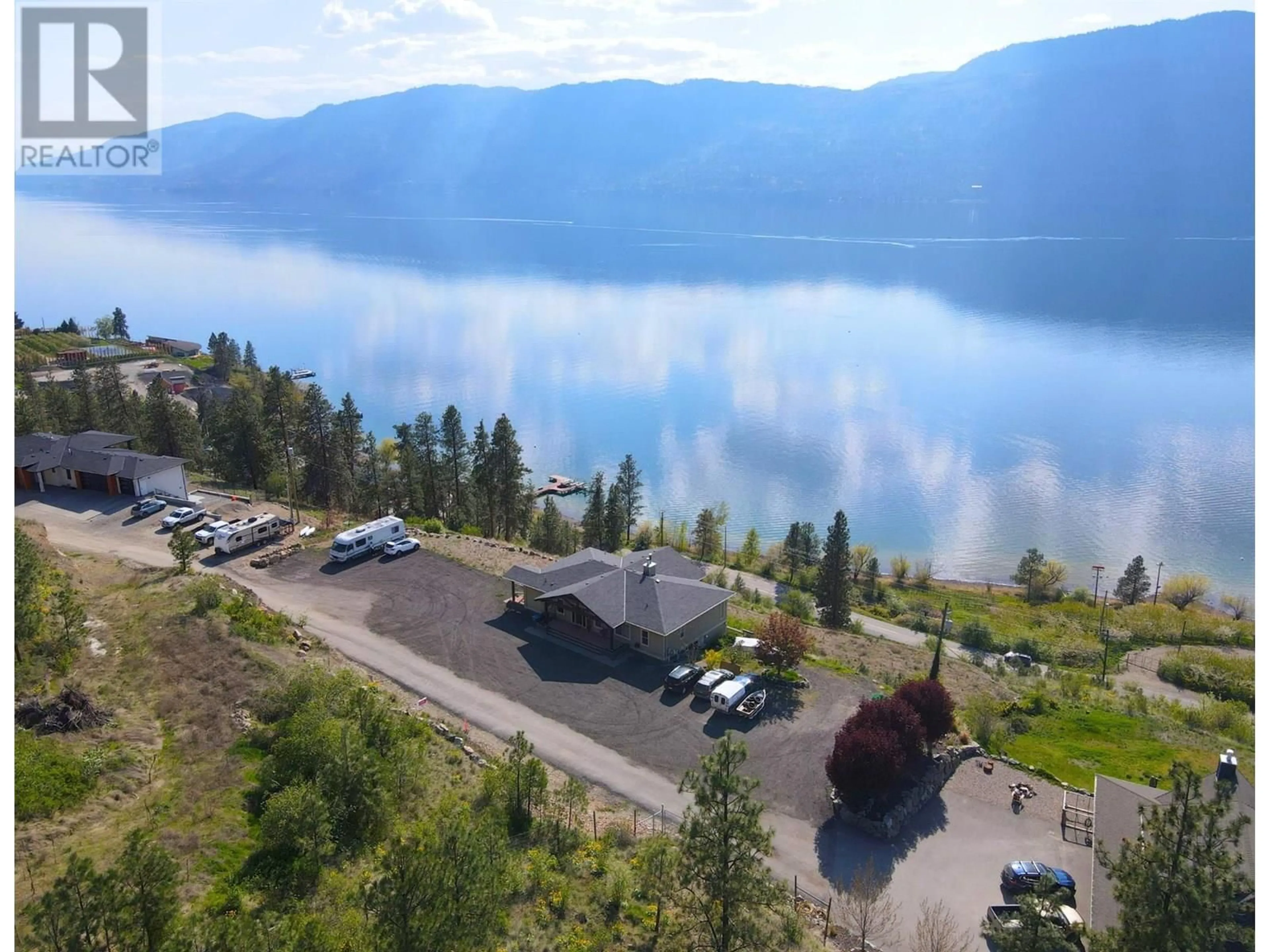 A pic from outside/outdoor area/front of a property/back of a property/a pic from drone, water/lake/river/ocean view for 13938 MOBERLY ROAD, Lake Country British Columbia V4V1A6