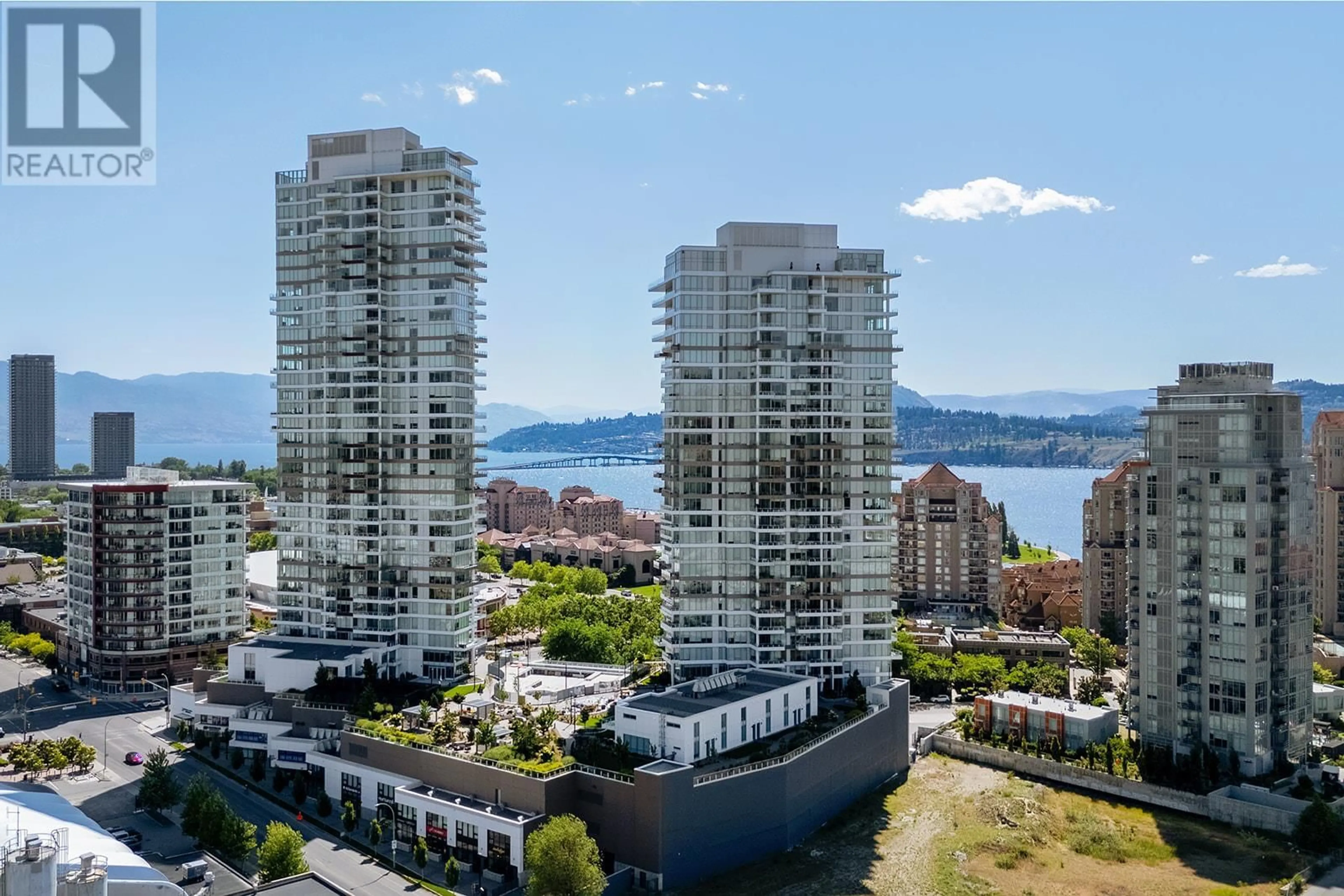 A pic from outside/outdoor area/front of a property/back of a property/a pic from drone, water/lake/river/ocean view for 1402 - 1181 SUNSET DRIVE, Kelowna British Columbia V1Y0L4