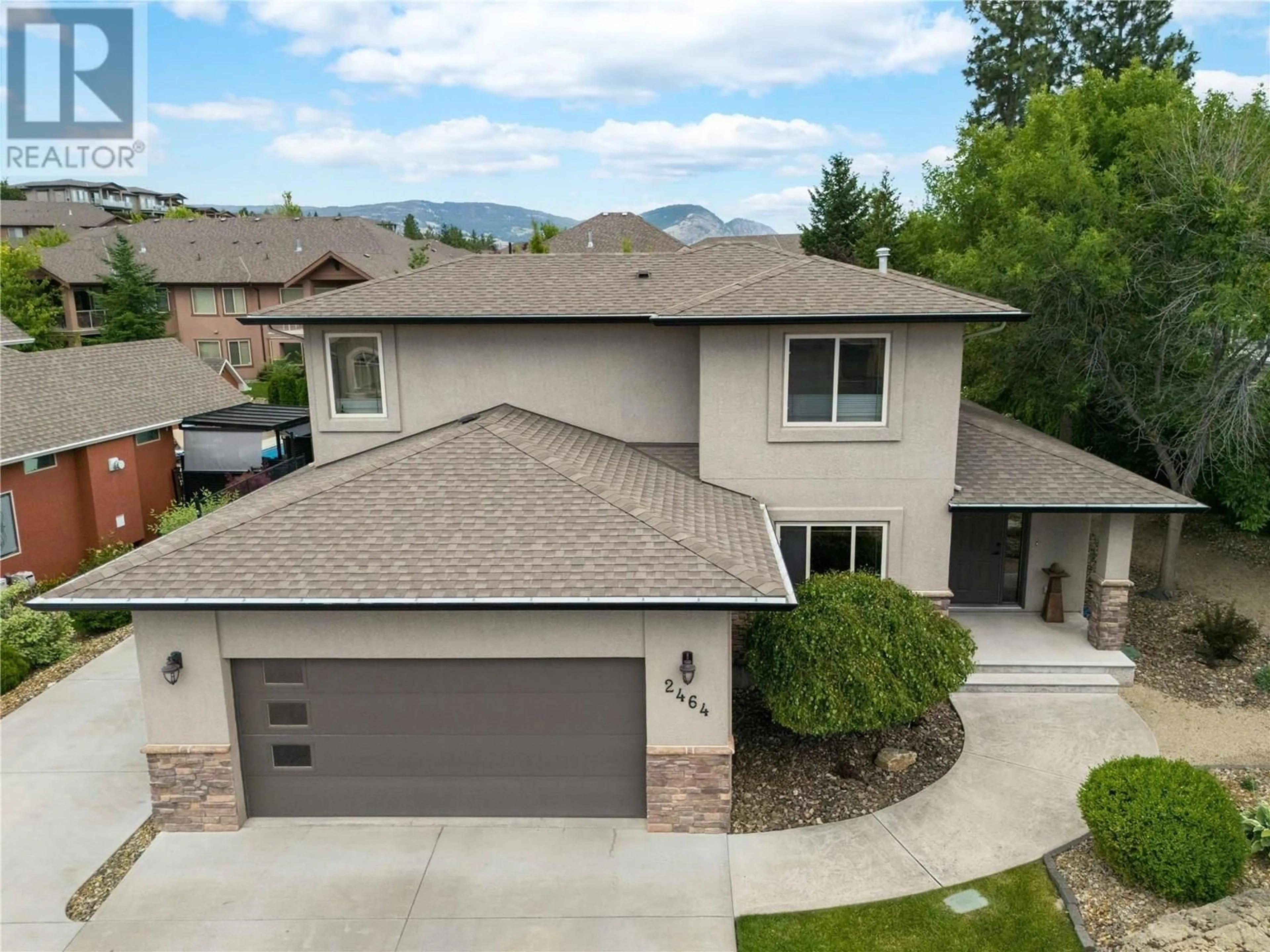 A pic from outside/outdoor area/front of a property/back of a property/a pic from drone, mountain view for 2464 SELKIRK DRIVE, Kelowna British Columbia V1V2R7