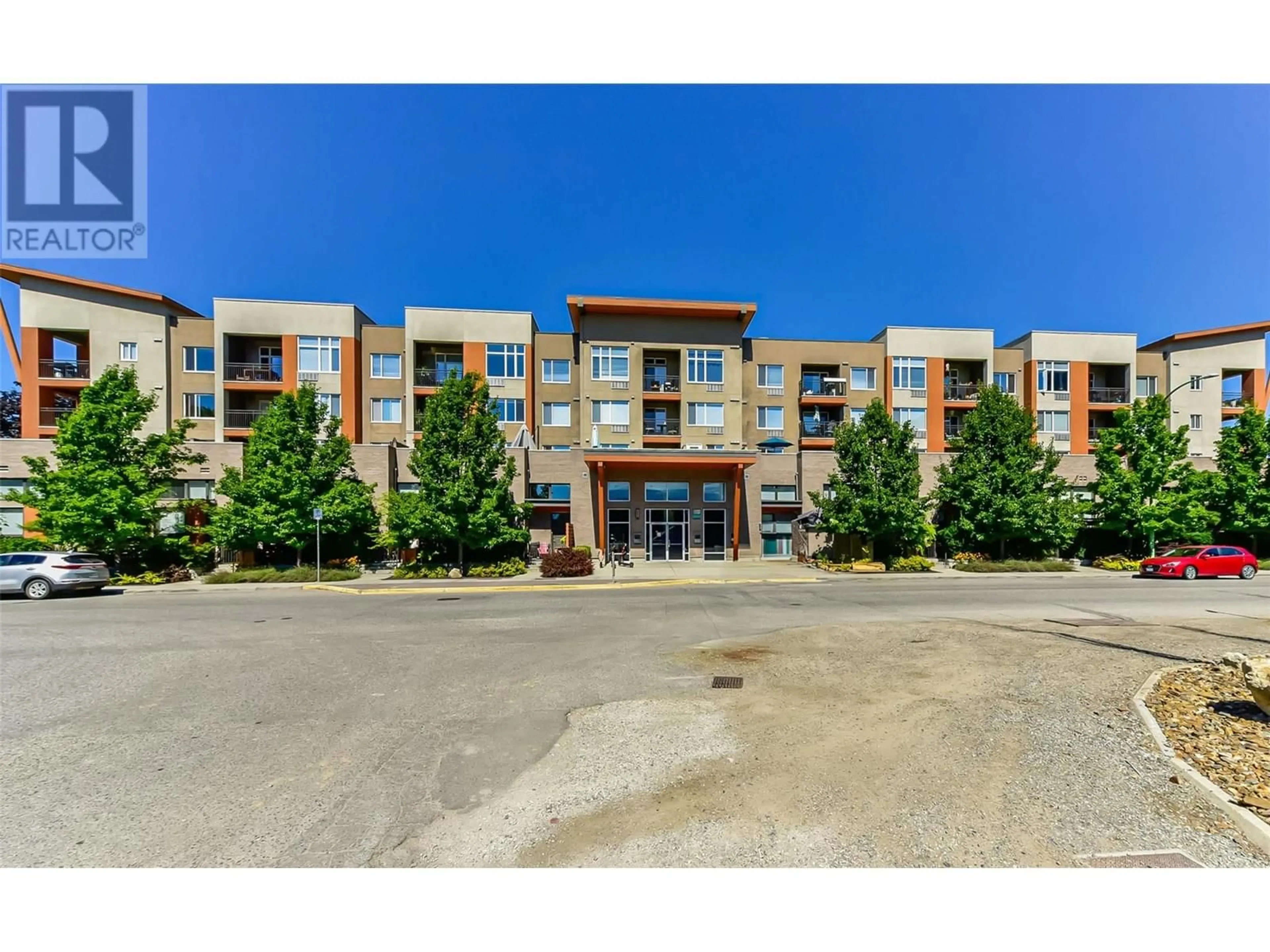 A pic from outside/outdoor area/front of a property/back of a property/a pic from drone, building for 303 - 1550 DICKSON AVENUE, Kelowna British Columbia V1Y9Y8