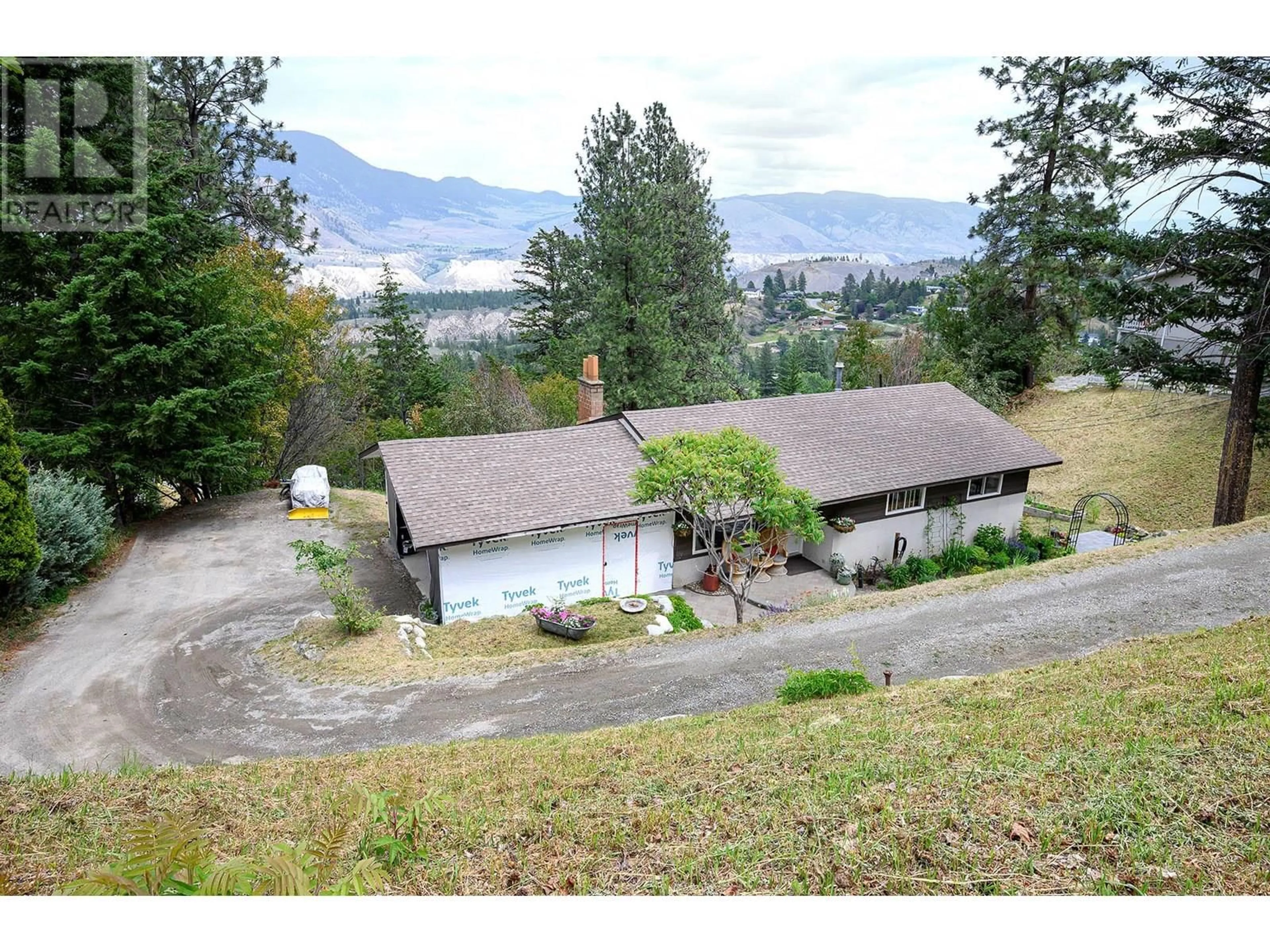 A pic from outside/outdoor area/front of a property/back of a property/a pic from drone, mountain view for 5350 RONDE LANE, Kamloops British Columbia V2C5H6
