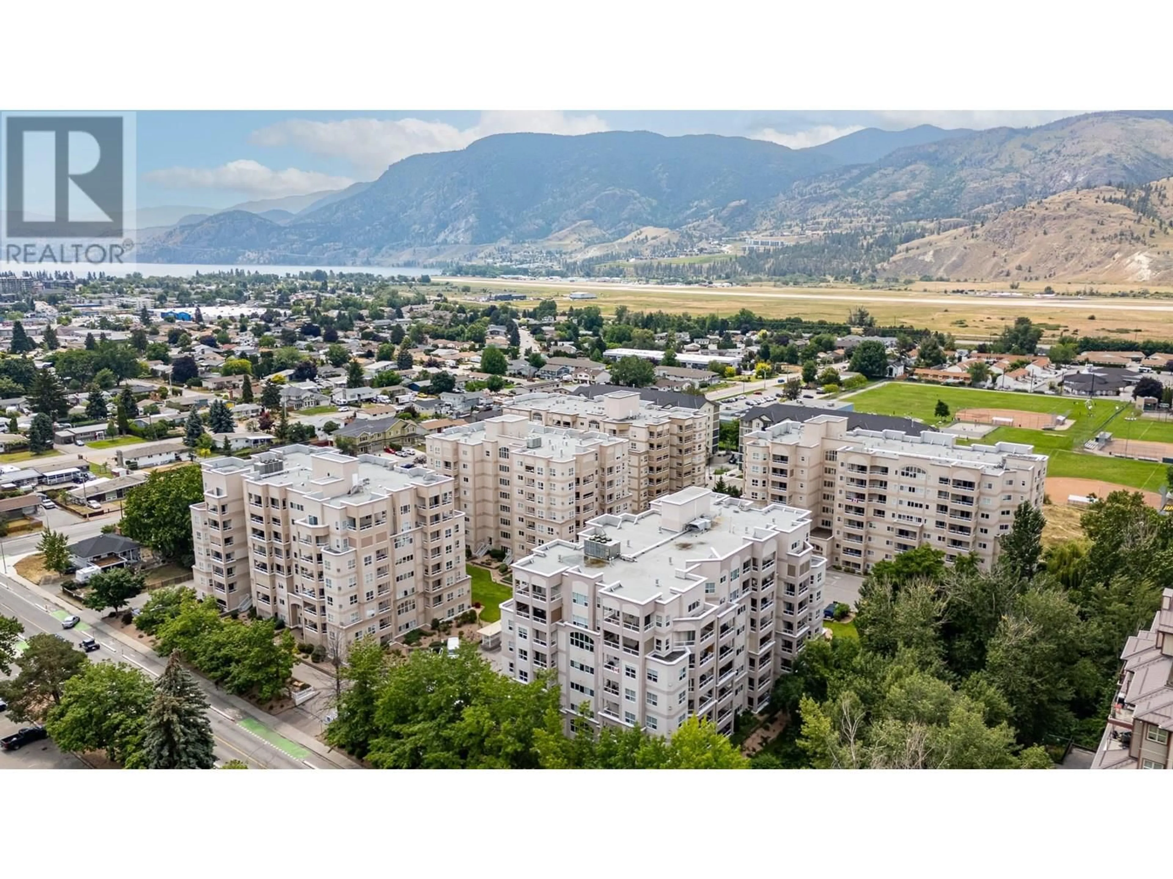A pic from outside/outdoor area/front of a property/back of a property/a pic from drone, mountain view for 305 - 2245 ATKINSON STREET, Penticton British Columbia V2A8R7