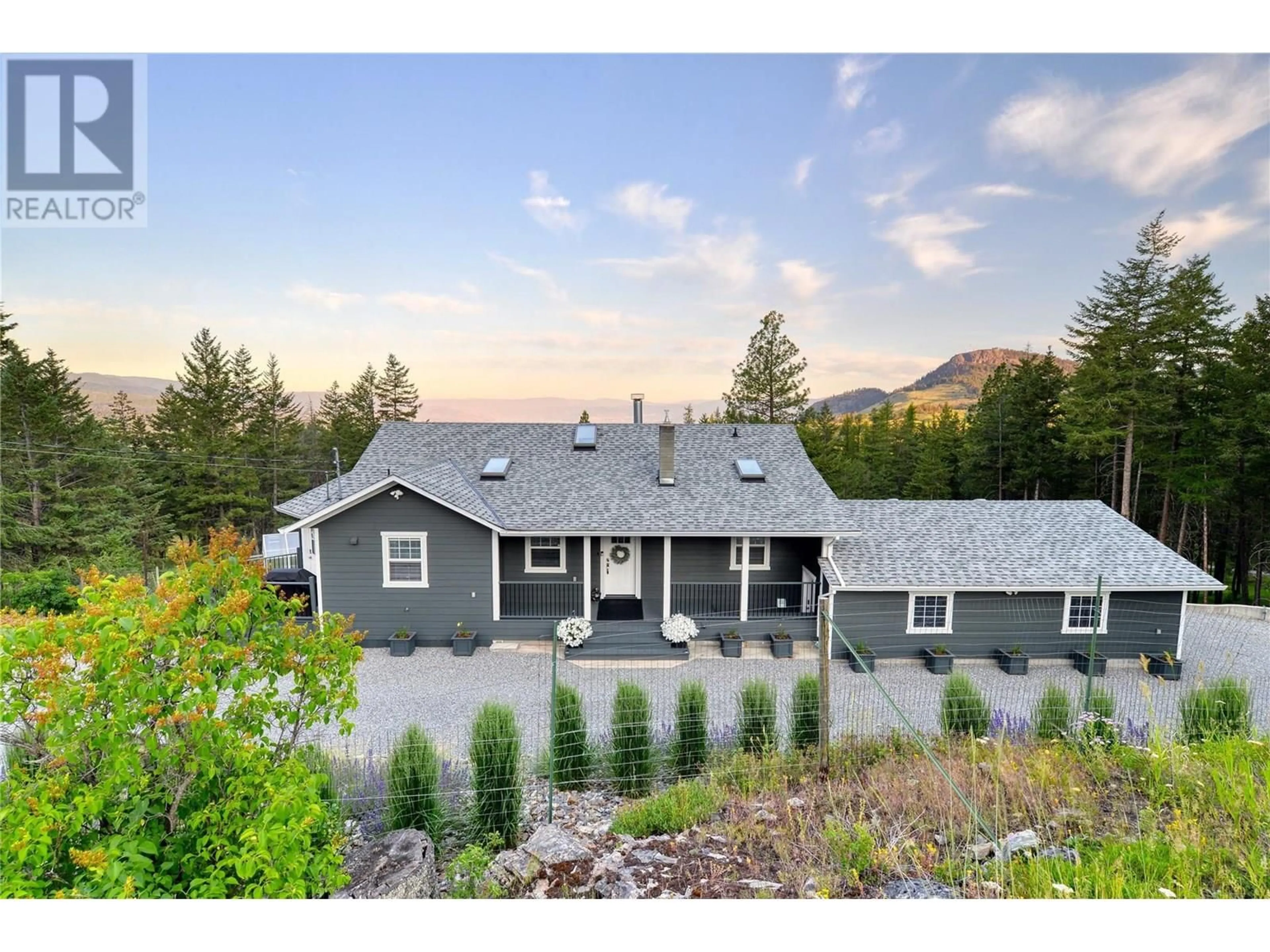 A pic from outside/outdoor area/front of a property/back of a property/a pic from drone, mountain view for 2025 HUCKLEBERRY ROAD, Kelowna British Columbia V1P1H5