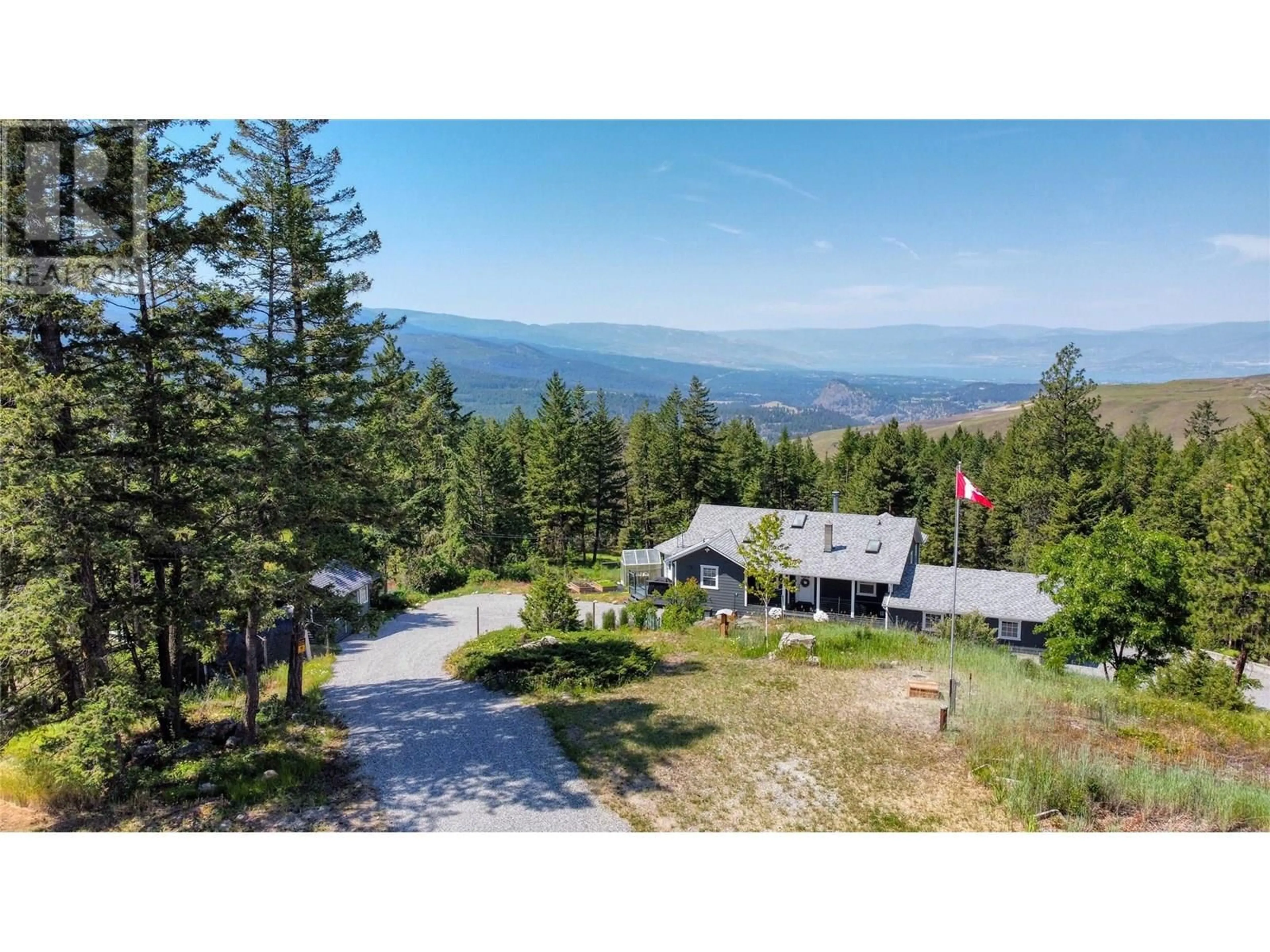 A pic from outside/outdoor area/front of a property/back of a property/a pic from drone, mountain view for 2025 HUCKLEBERRY ROAD, Kelowna British Columbia V1P1H5