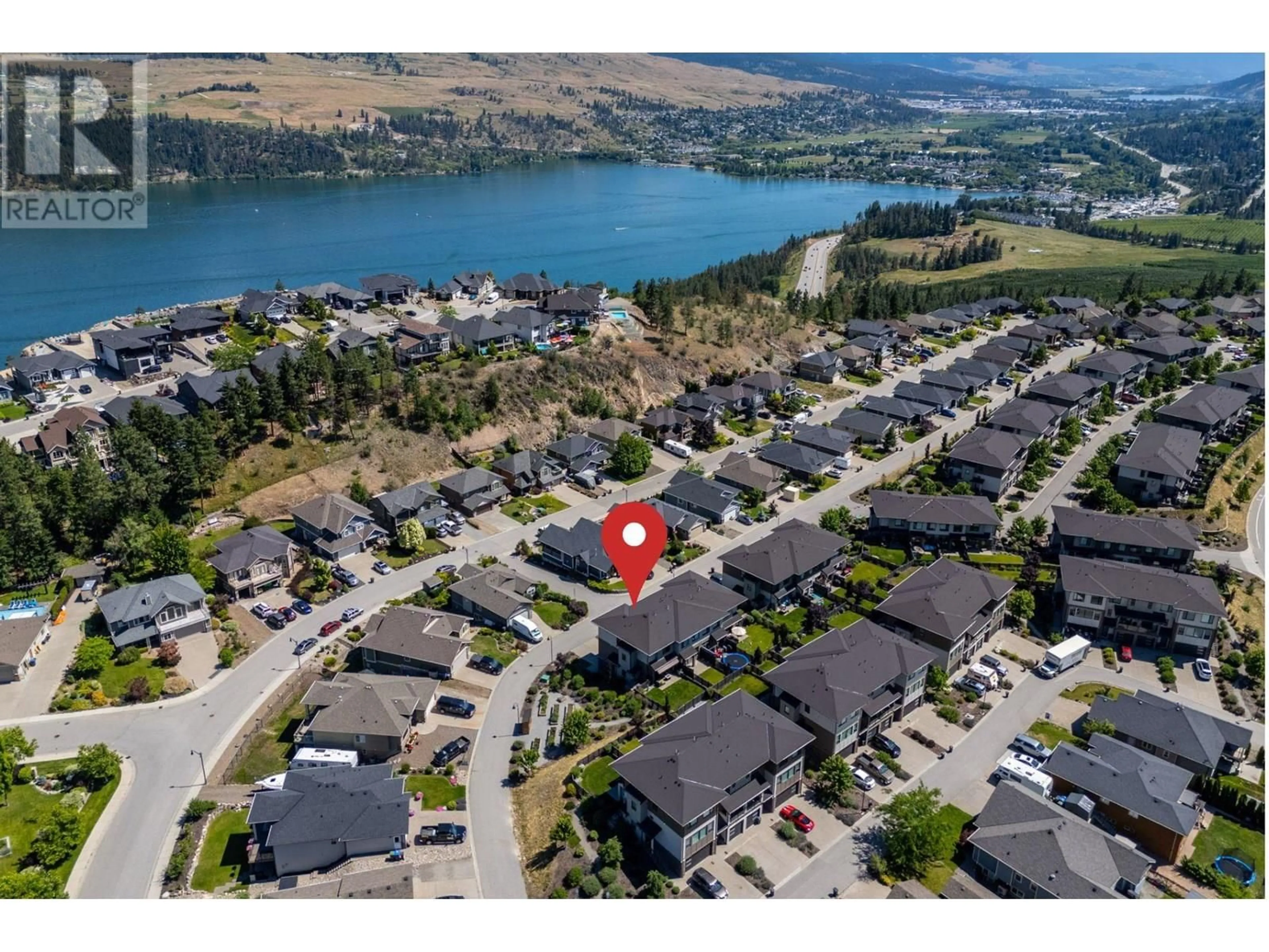 A pic from outside/outdoor area/front of a property/back of a property/a pic from drone, water/lake/river/ocean view for 60 - 12798 LAKE HILL DRIVE, Lake Country British Columbia V4V2W5