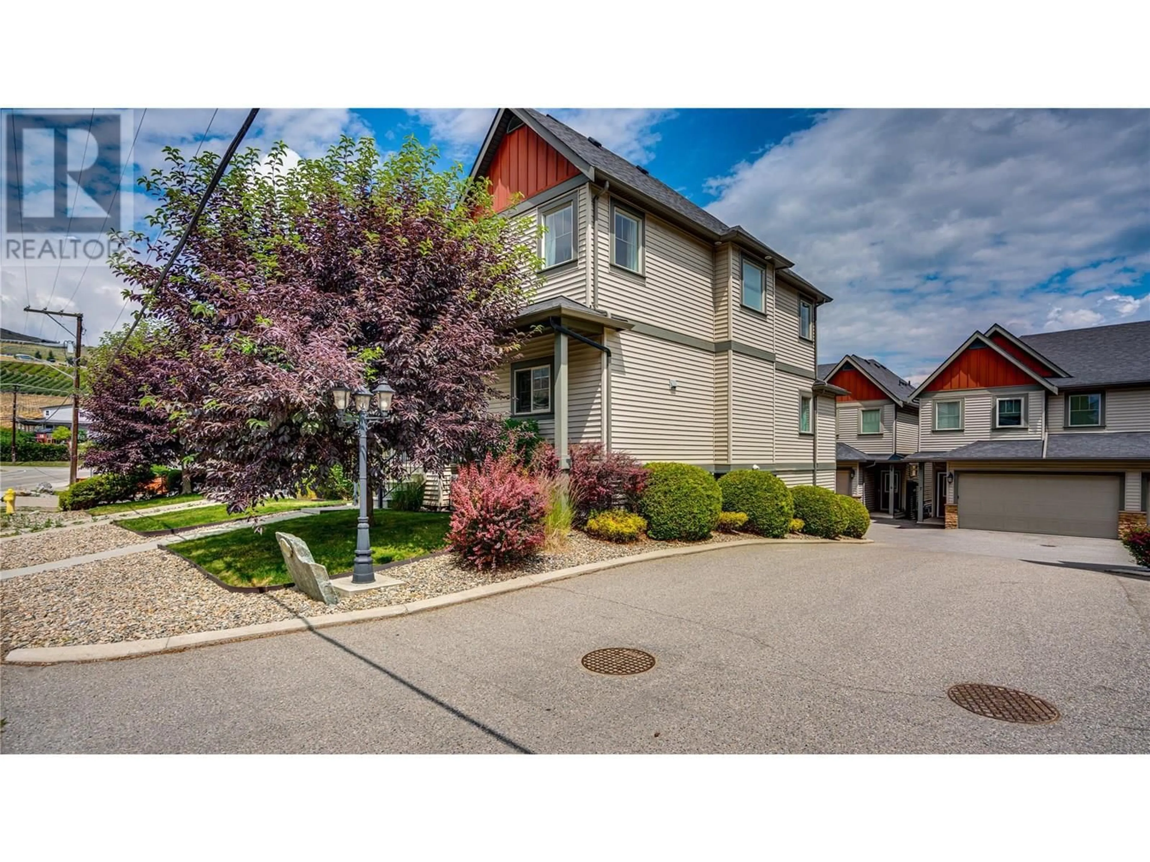 A pic from outside/outdoor area/front of a property/back of a property/a pic from drone, street for 1 - 4724 HERITAGE DRIVE, Vernon British Columbia V1T7V4