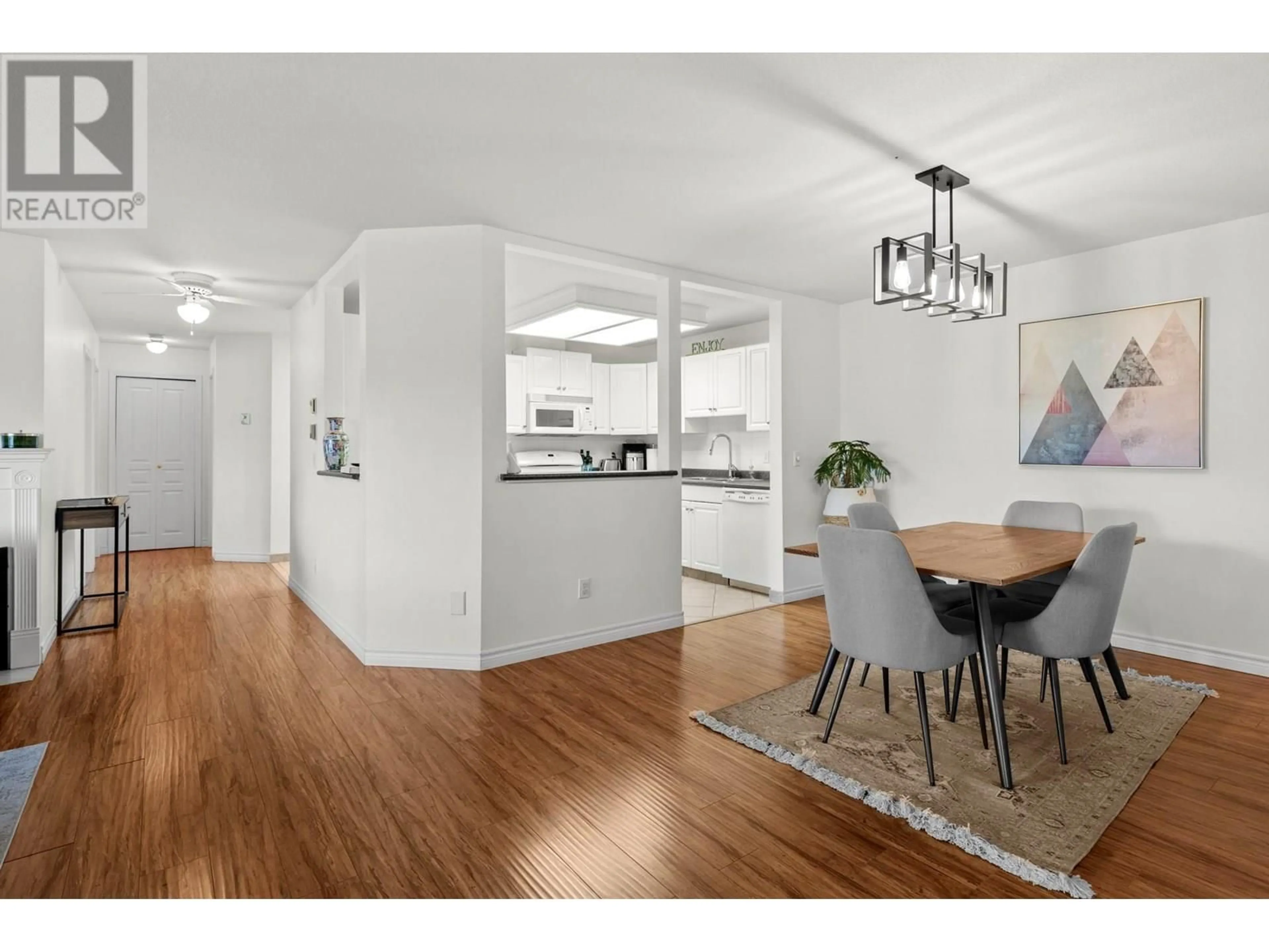 Open concept kitchen, wood/laminate floor for 205 - 645 BARRERA ROAD, Kelowna British Columbia V1W3C9