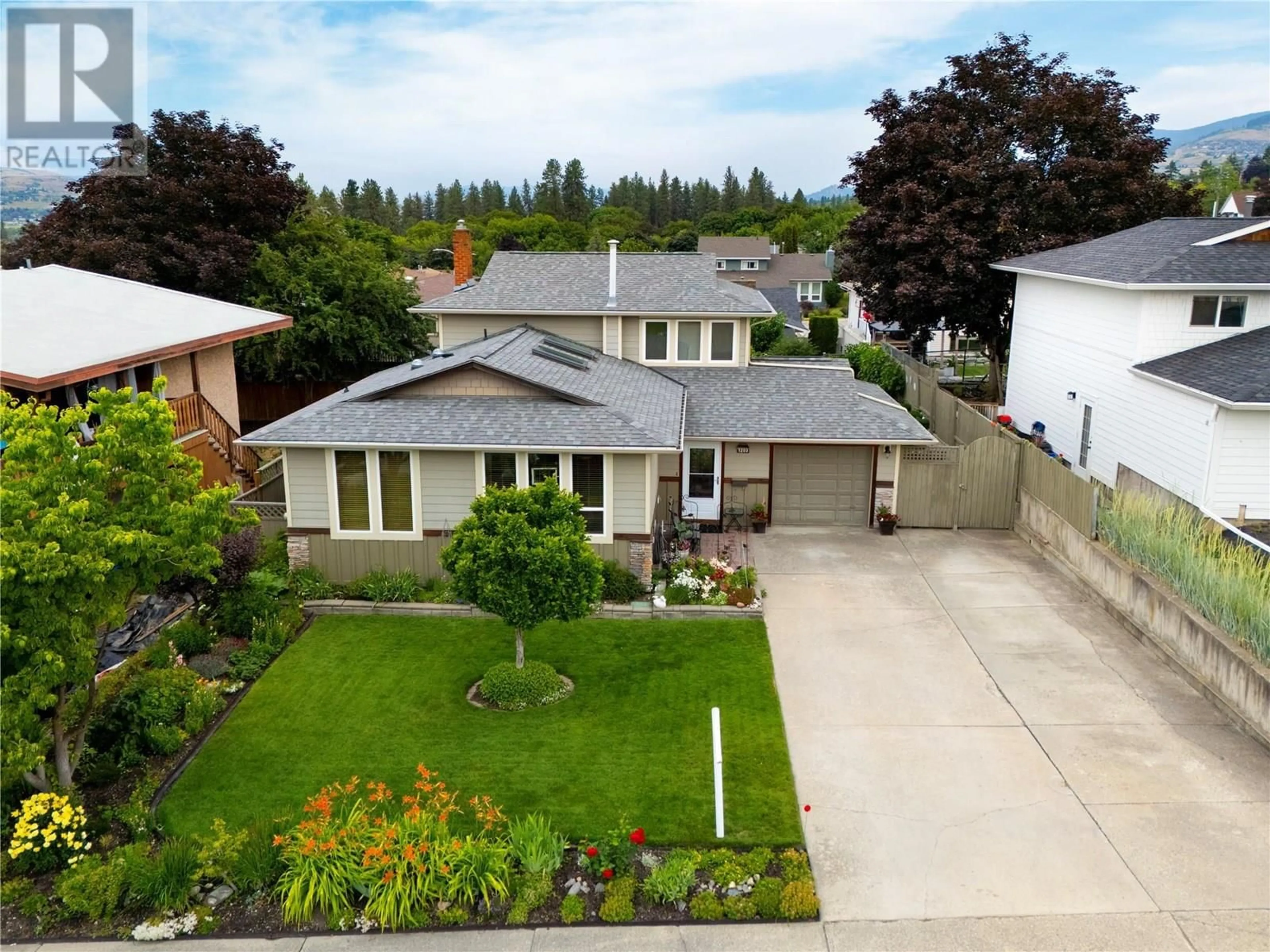 A pic from outside/outdoor area/front of a property/back of a property/a pic from drone, street for 1203 41 AVENUE, Vernon British Columbia V1T8A6
