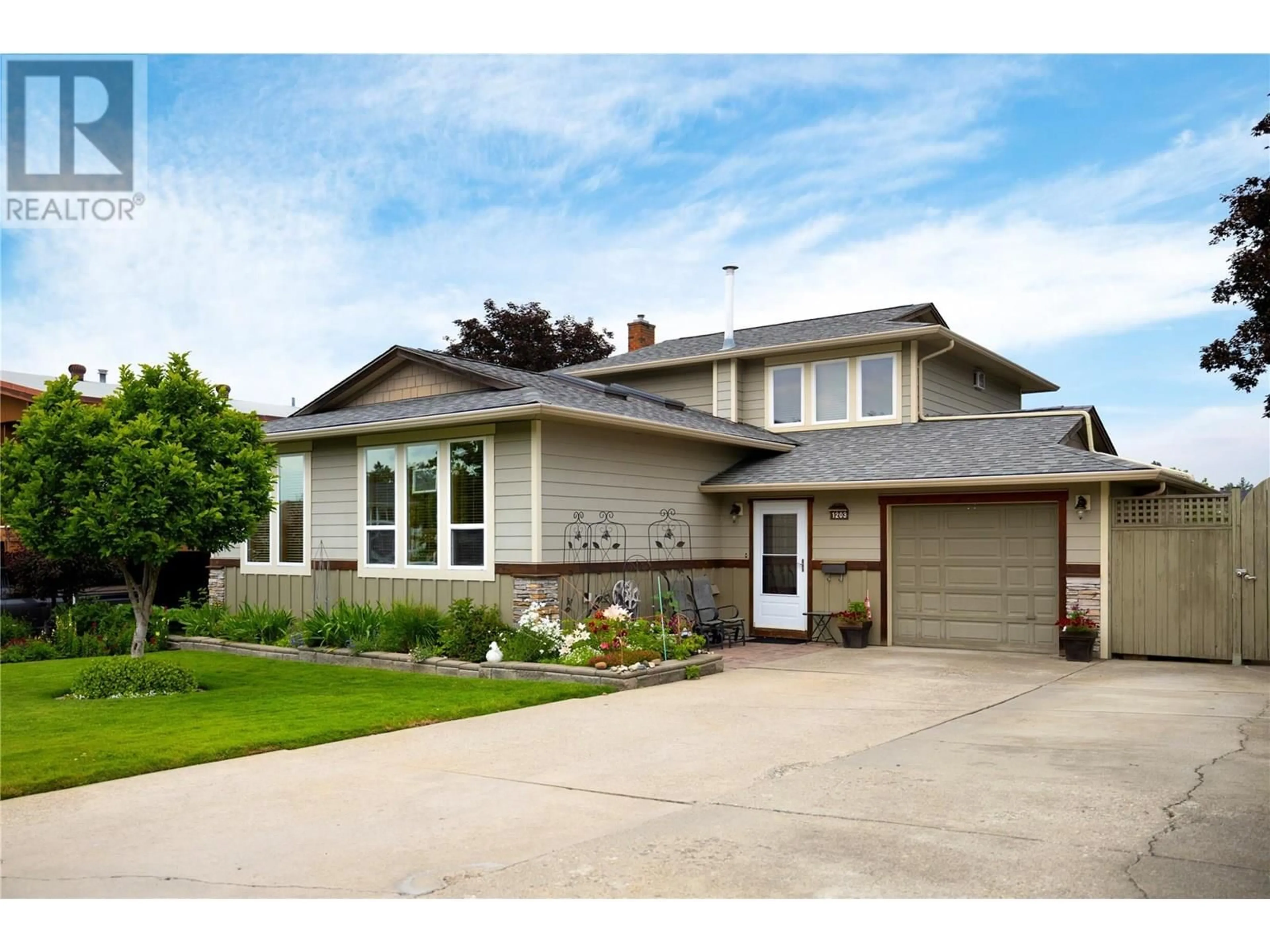 Home with vinyl exterior material, street for 1203 41 AVENUE, Vernon British Columbia V1T8A6