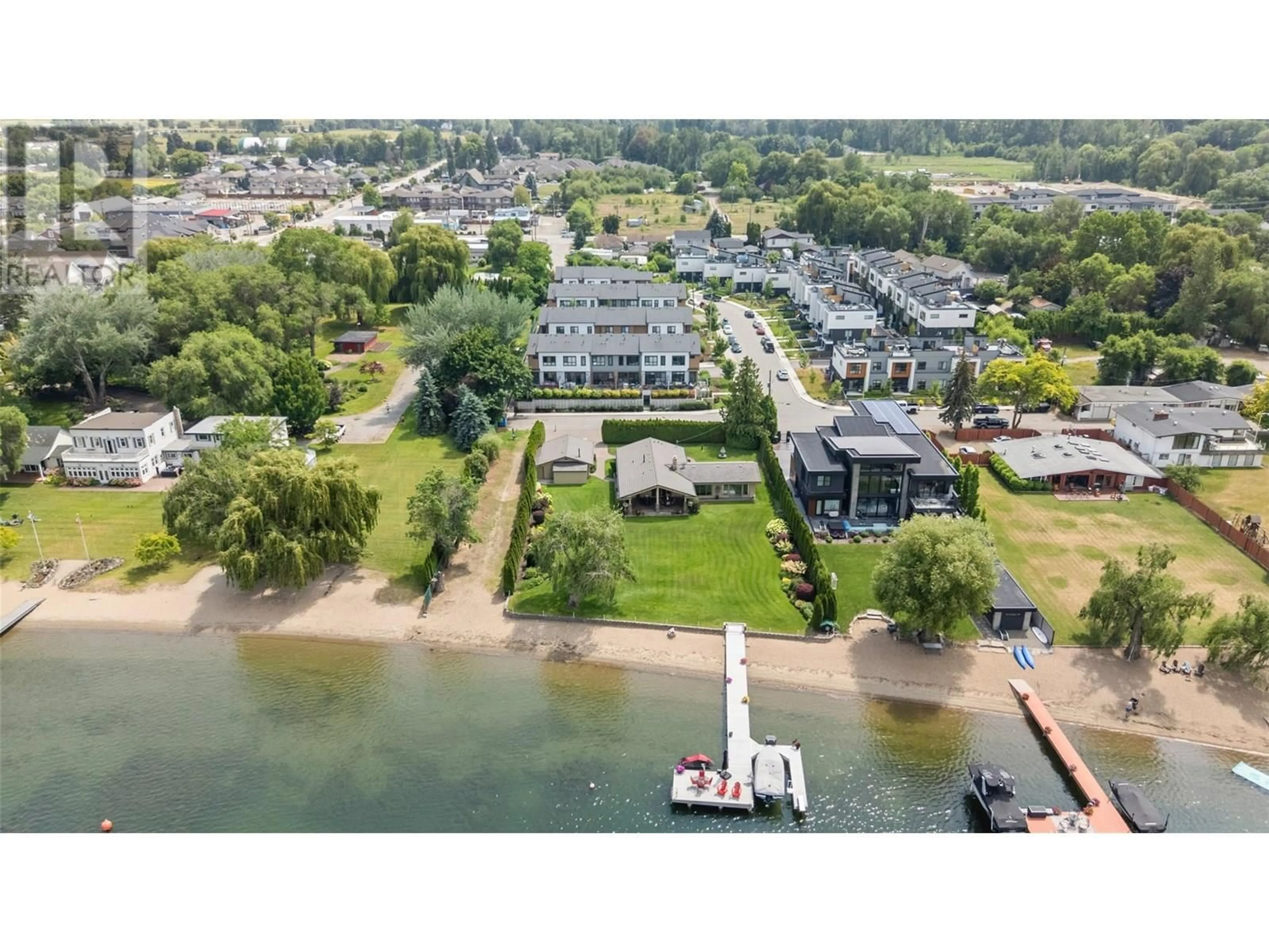 A pic from outside/outdoor area/front of a property/back of a property/a pic from drone, water/lake/river/ocean view for 104 - 11581 ROGERS ROAD, Lake Country British Columbia V4V1X8