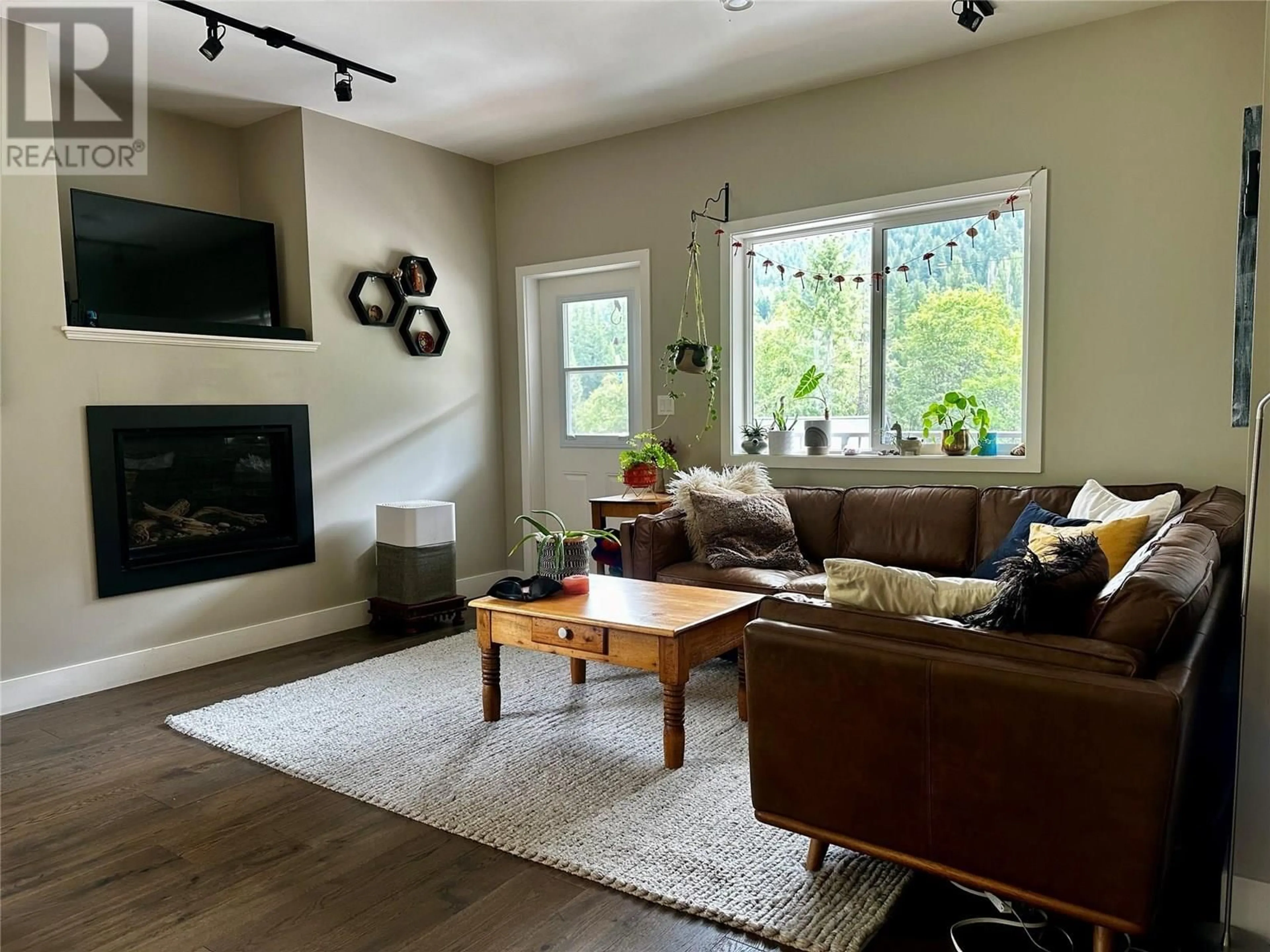 Living room with furniture, wood/laminate floor for A - 2410 PERRIER LANE, Nelson British Columbia V1L7C3