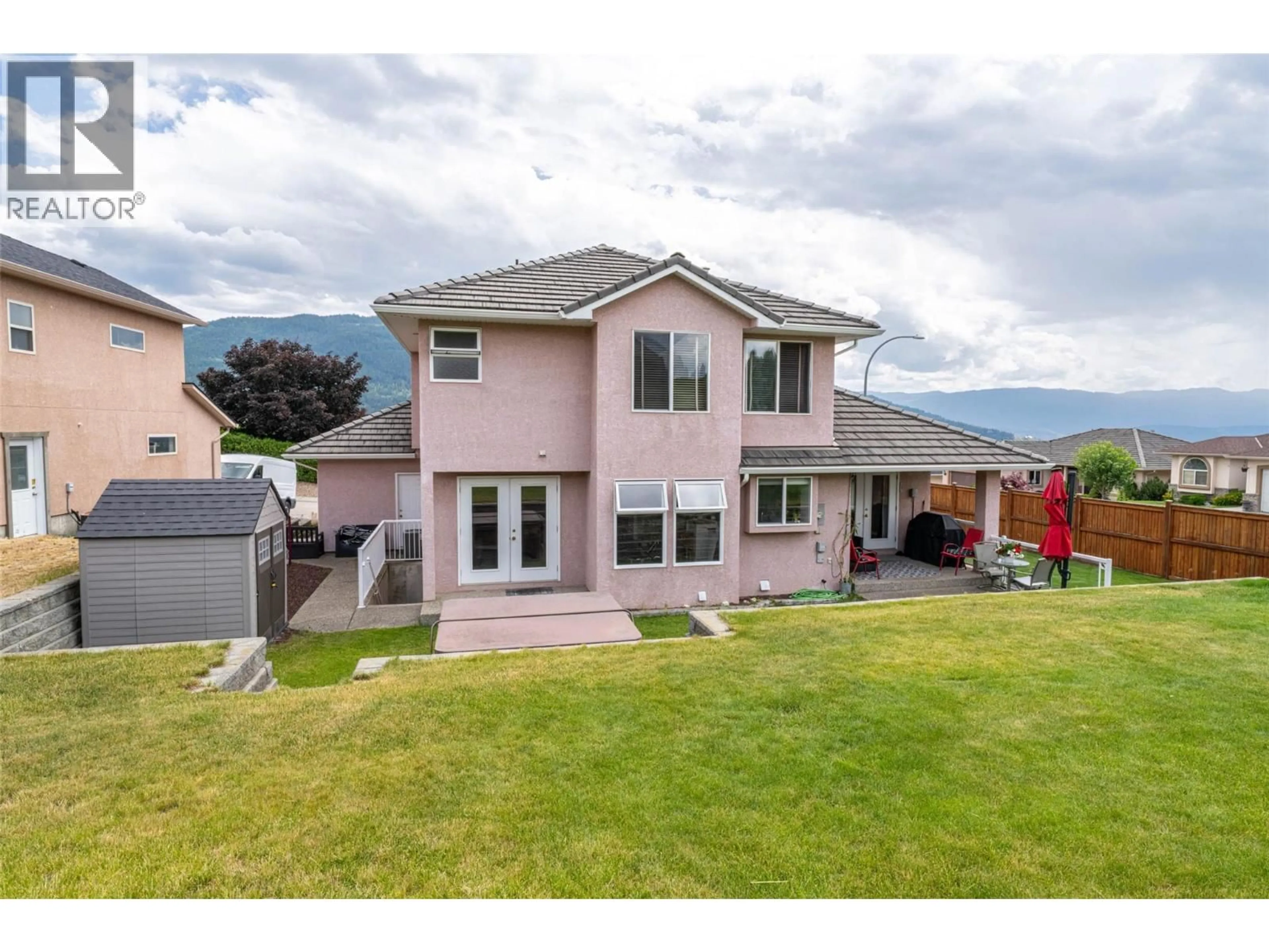 A pic from outside/outdoor area/front of a property/back of a property/a pic from drone, mountain view for 400 FORTRESS CRESCENT, Vernon British Columbia V1B3W3