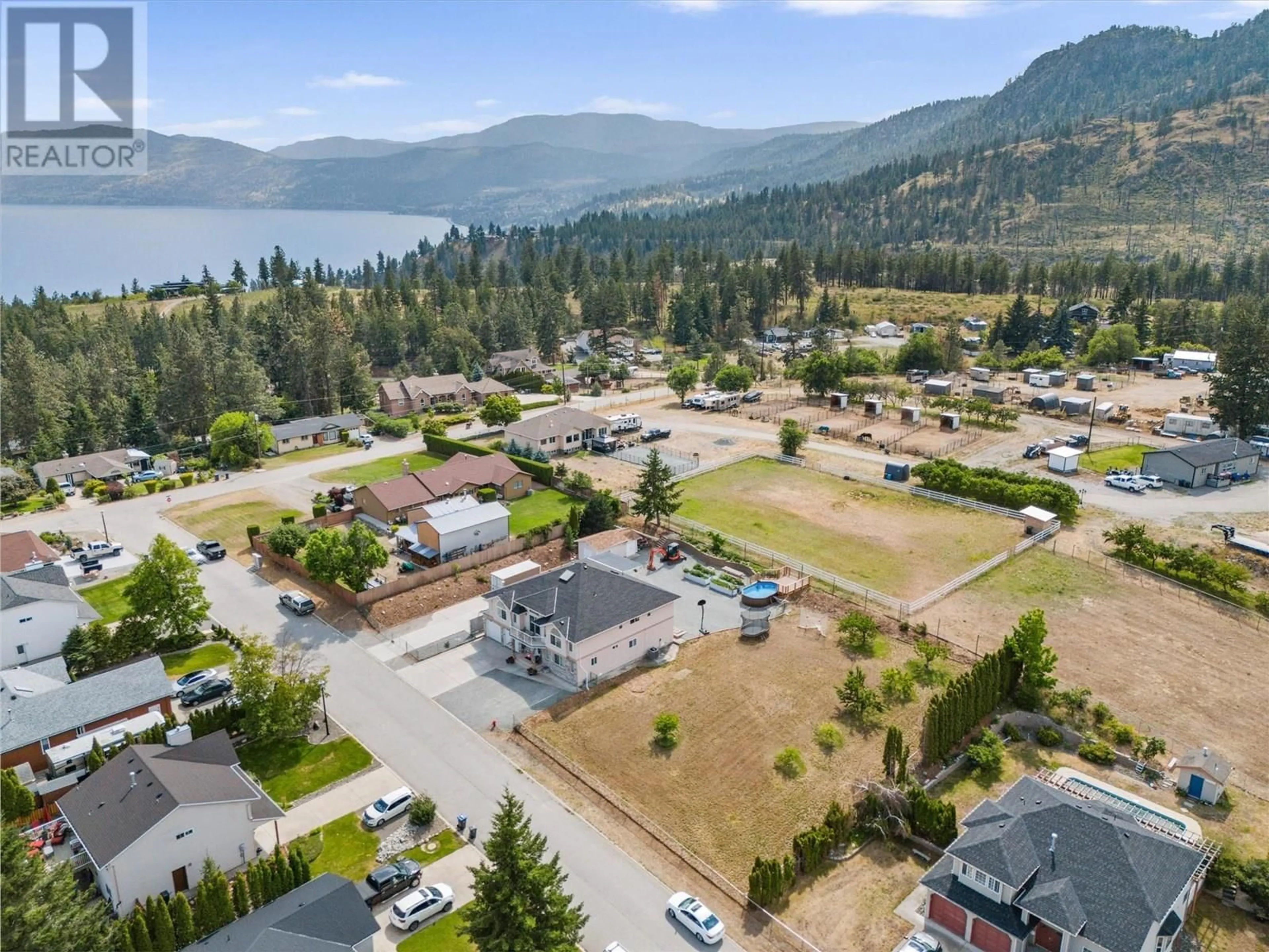 A pic from outside/outdoor area/front of a property/back of a property/a pic from drone, mountain view for 4029 SMITH WAY, Peachland British Columbia V0H1X2