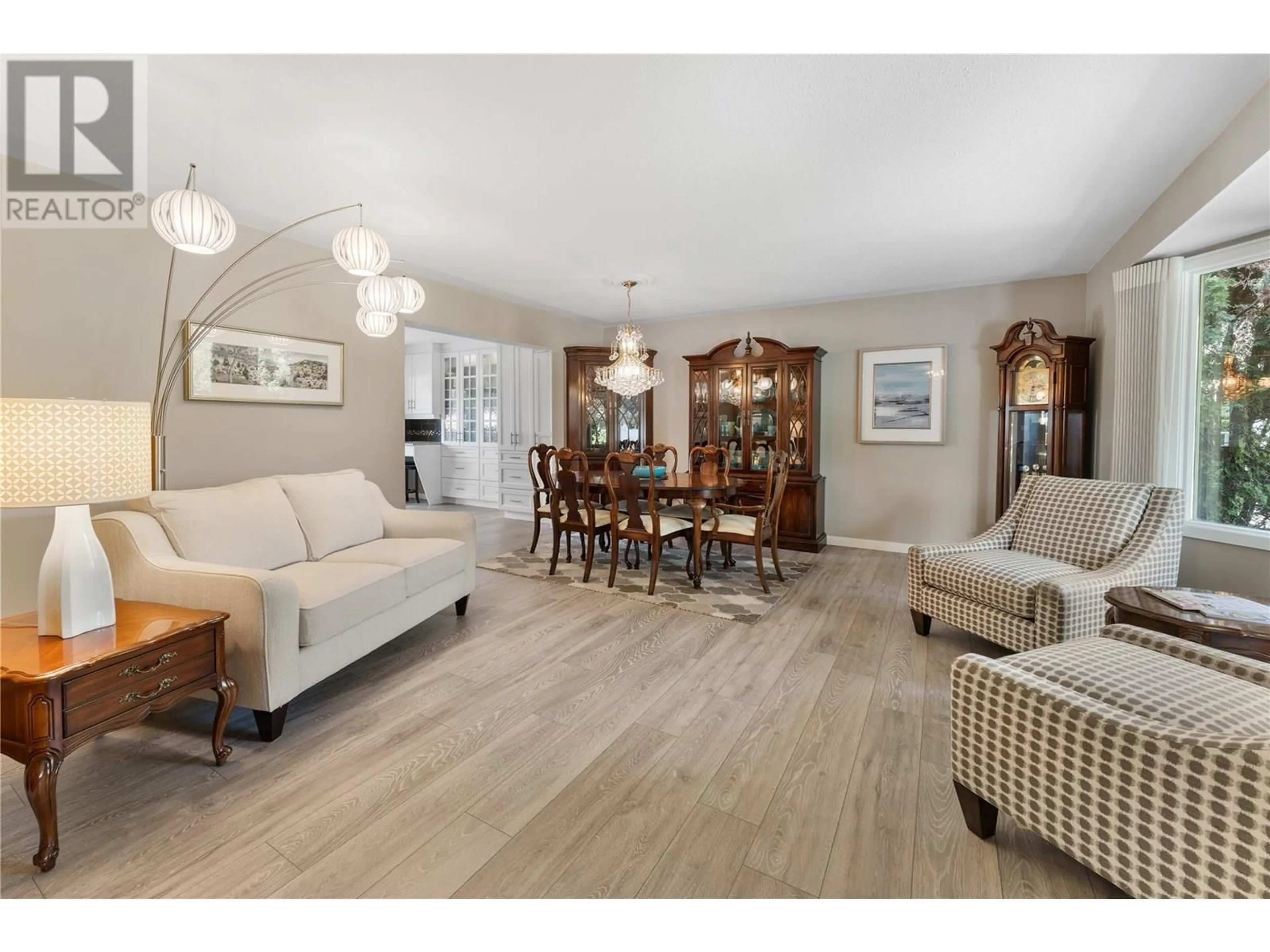 Living room with furniture, wood/laminate floor for 4492 SWAISLAND ROAD, Kelowna British Columbia V1W1Y7