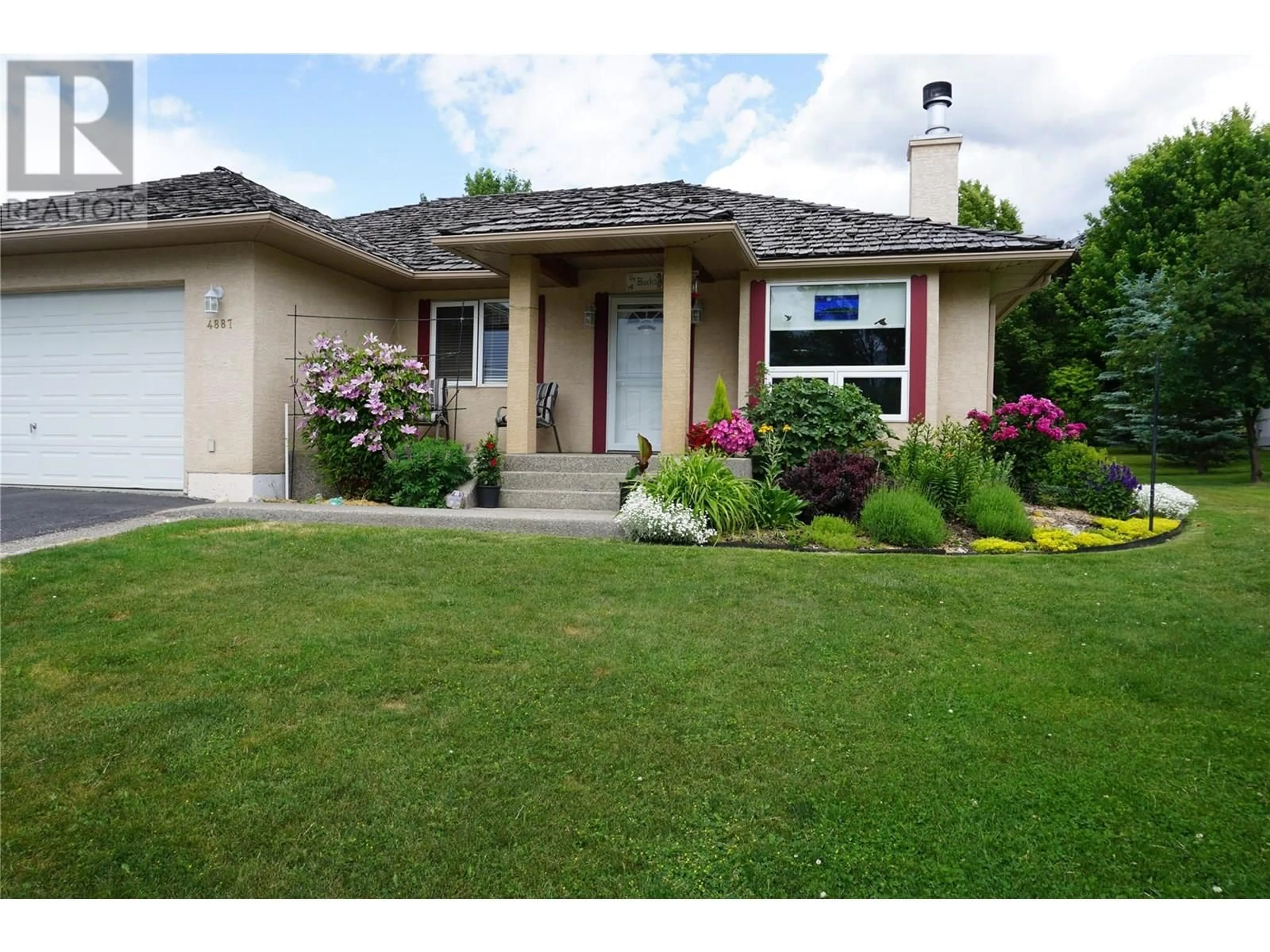 Home with vinyl exterior material, street for 4887 GLEN EAGLE DRIVE, Fairmont Hot Springs British Columbia V0B1L1