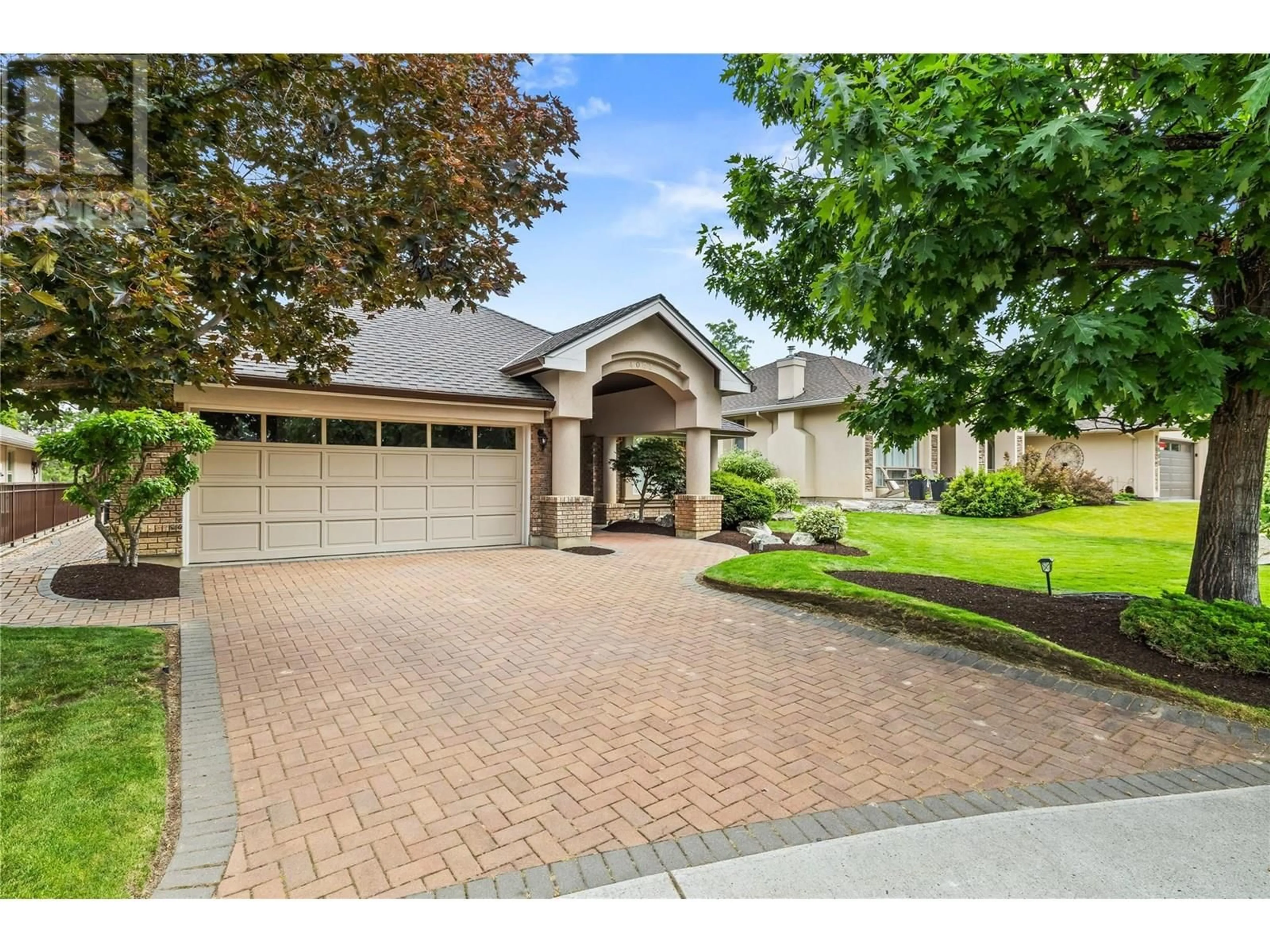 Home with brick exterior material, street for 4003 GALLAGHERS TERRACE, Kelowna British Columbia V1W3Z8