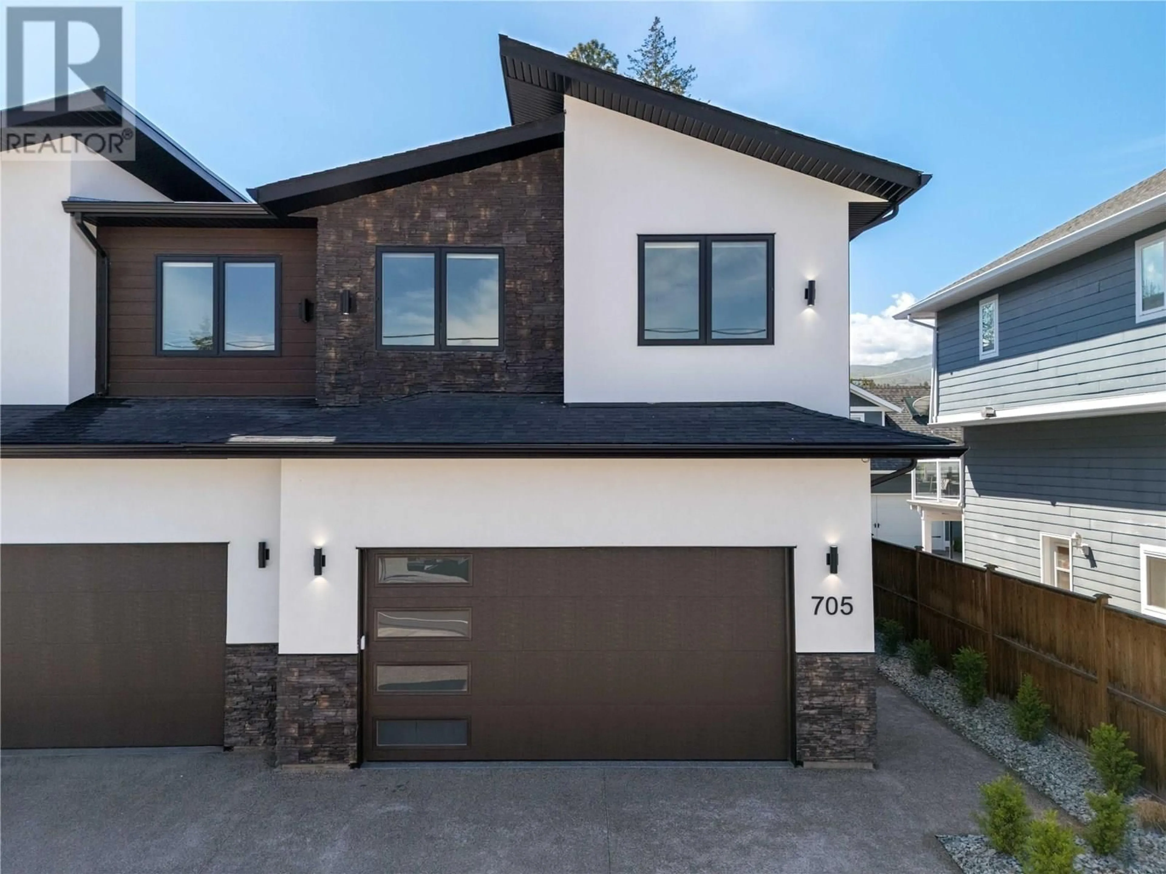 Home with brick exterior material, street for 705 RAYMER ROAD, Kelowna British Columbia V1W1H6