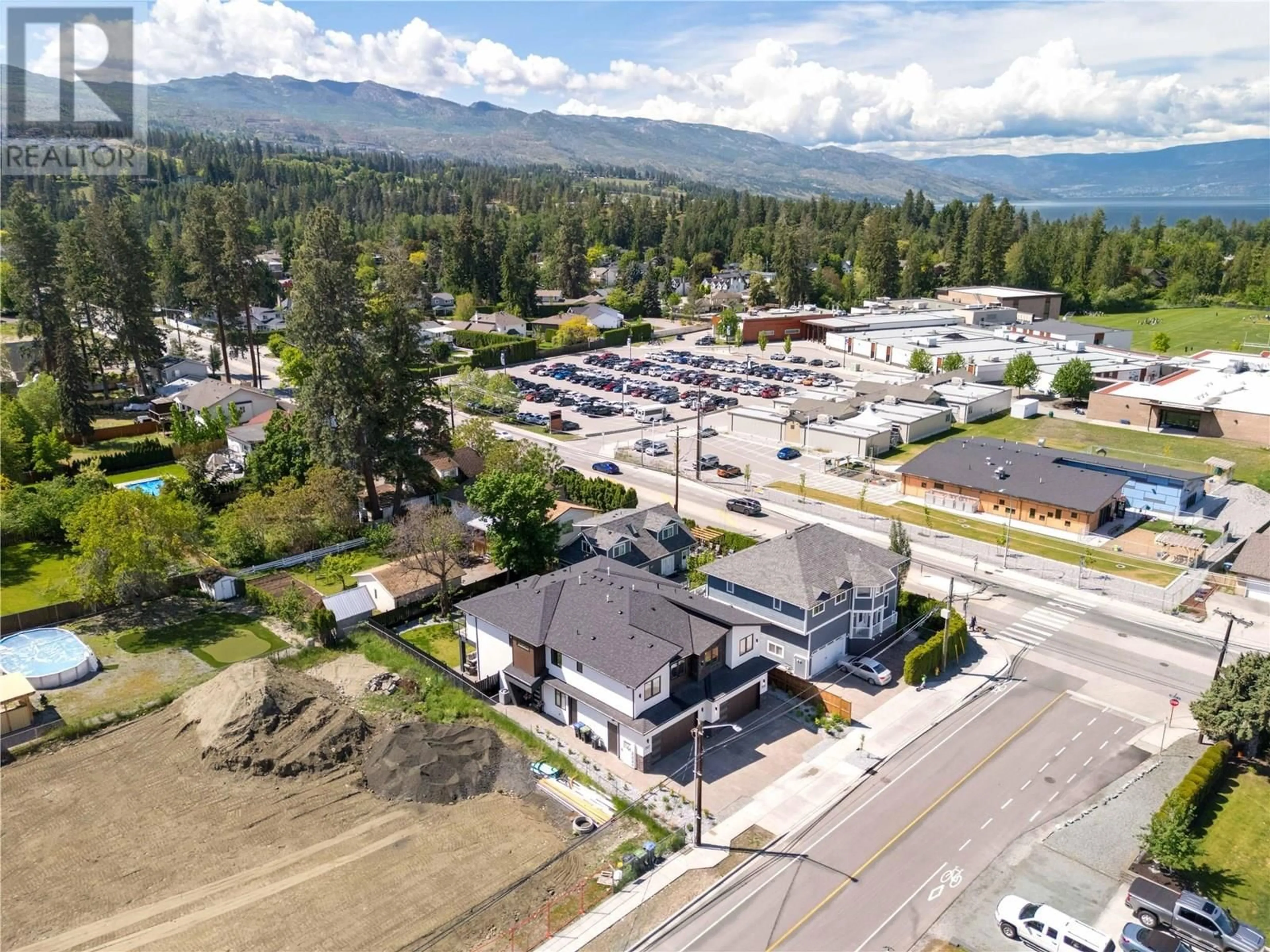 A pic from outside/outdoor area/front of a property/back of a property/a pic from drone, mountain view for 705 RAYMER ROAD, Kelowna British Columbia V1W1H6