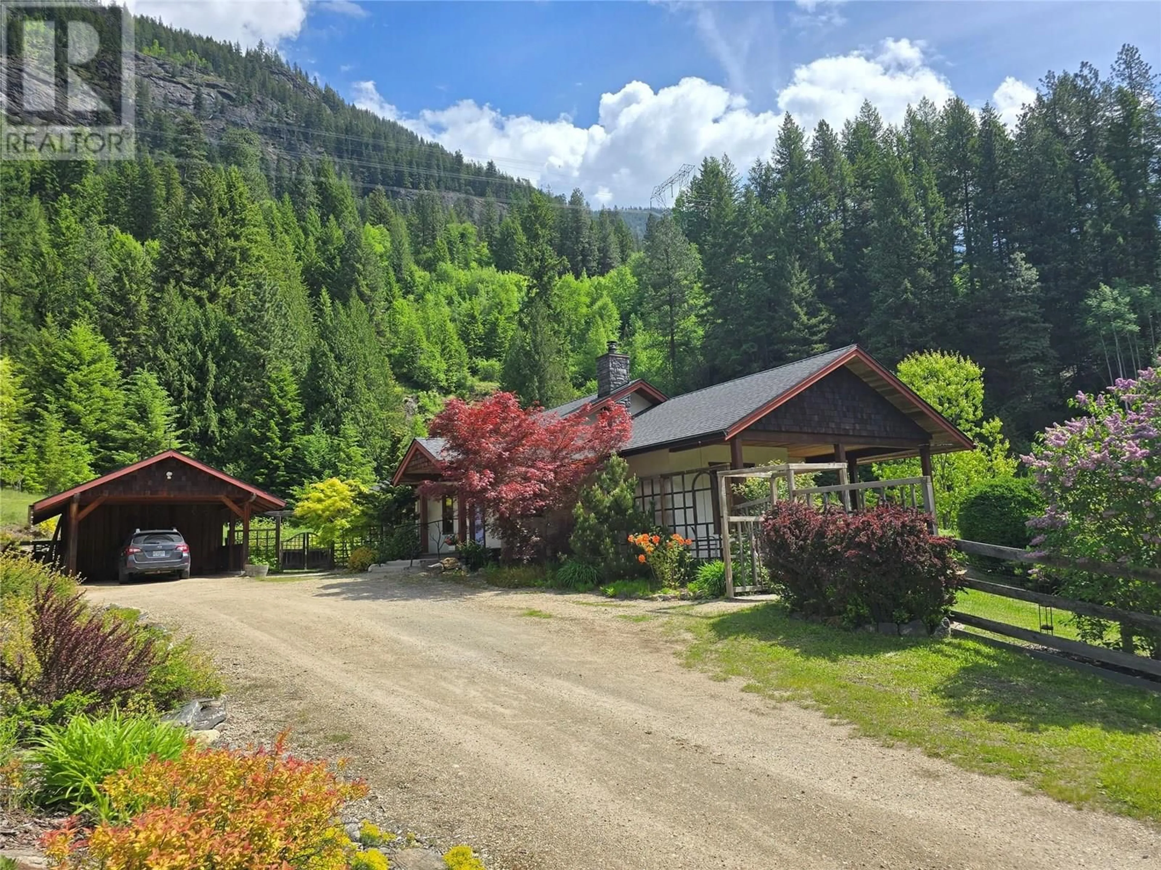 A pic from outside/outdoor area/front of a property/back of a property/a pic from drone, mountain view for 3092 POOHACHOFF ROAD, Slocan Park British Columbia V0G2E0