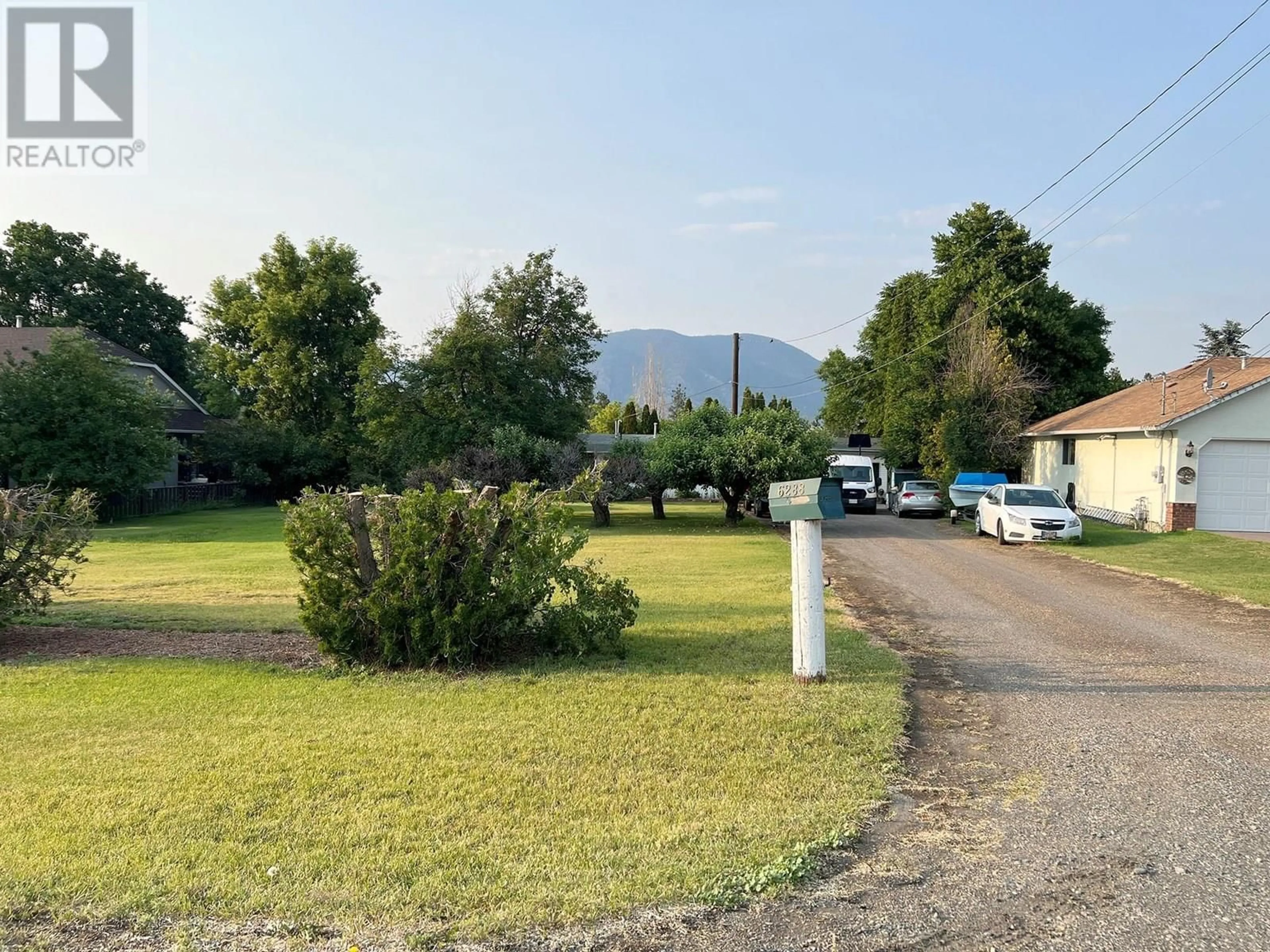 A pic from outside/outdoor area/front of a property/back of a property/a pic from drone, mountain view for 6288 MEADOWLAND CRESCENT, Kamloops British Columbia V2C5C2