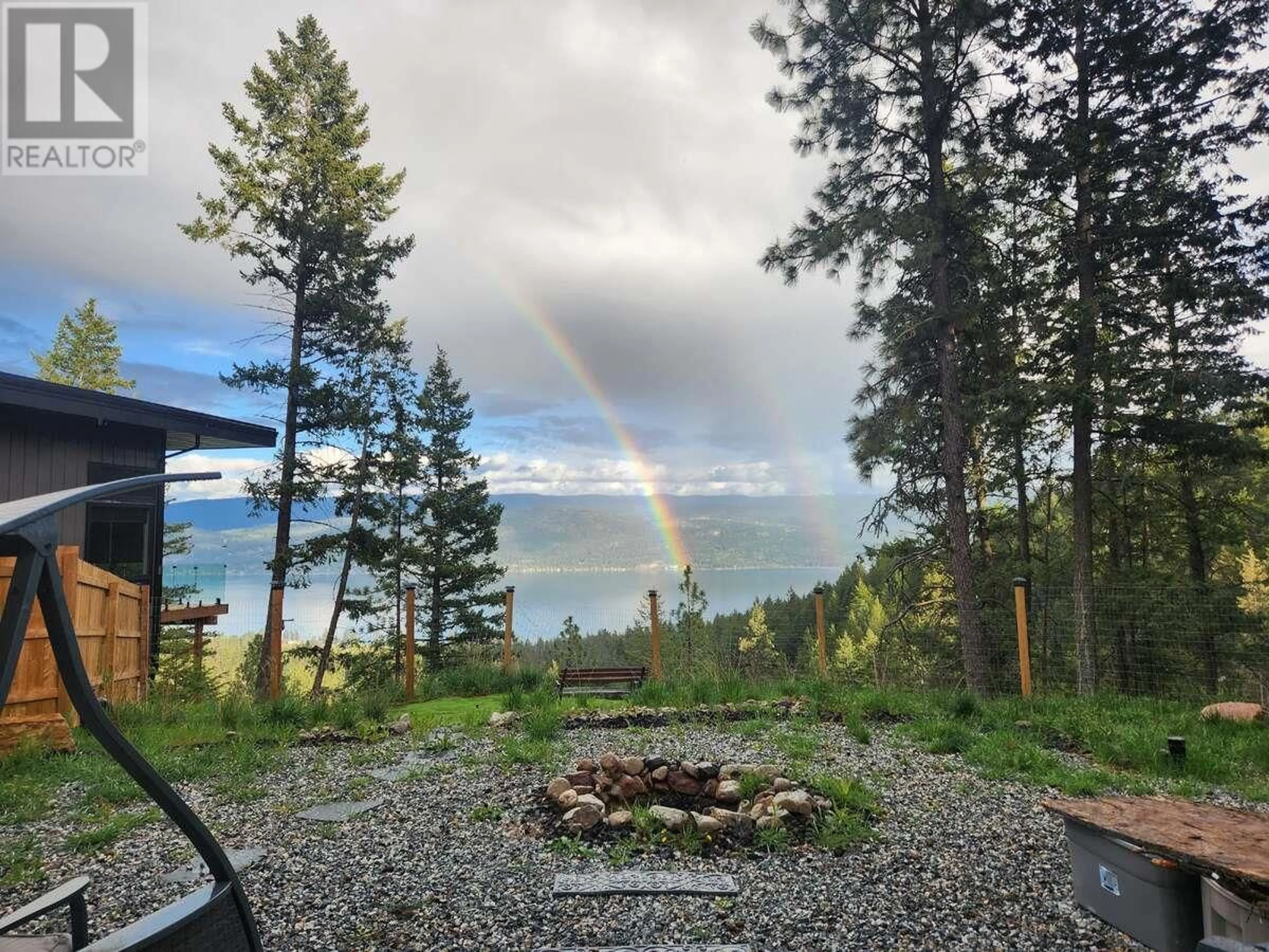 A pic from outside/outdoor area/front of a property/back of a property/a pic from drone, unknown for 10795 WESTSHORE ROAD, Vernon British Columbia V1H2C3