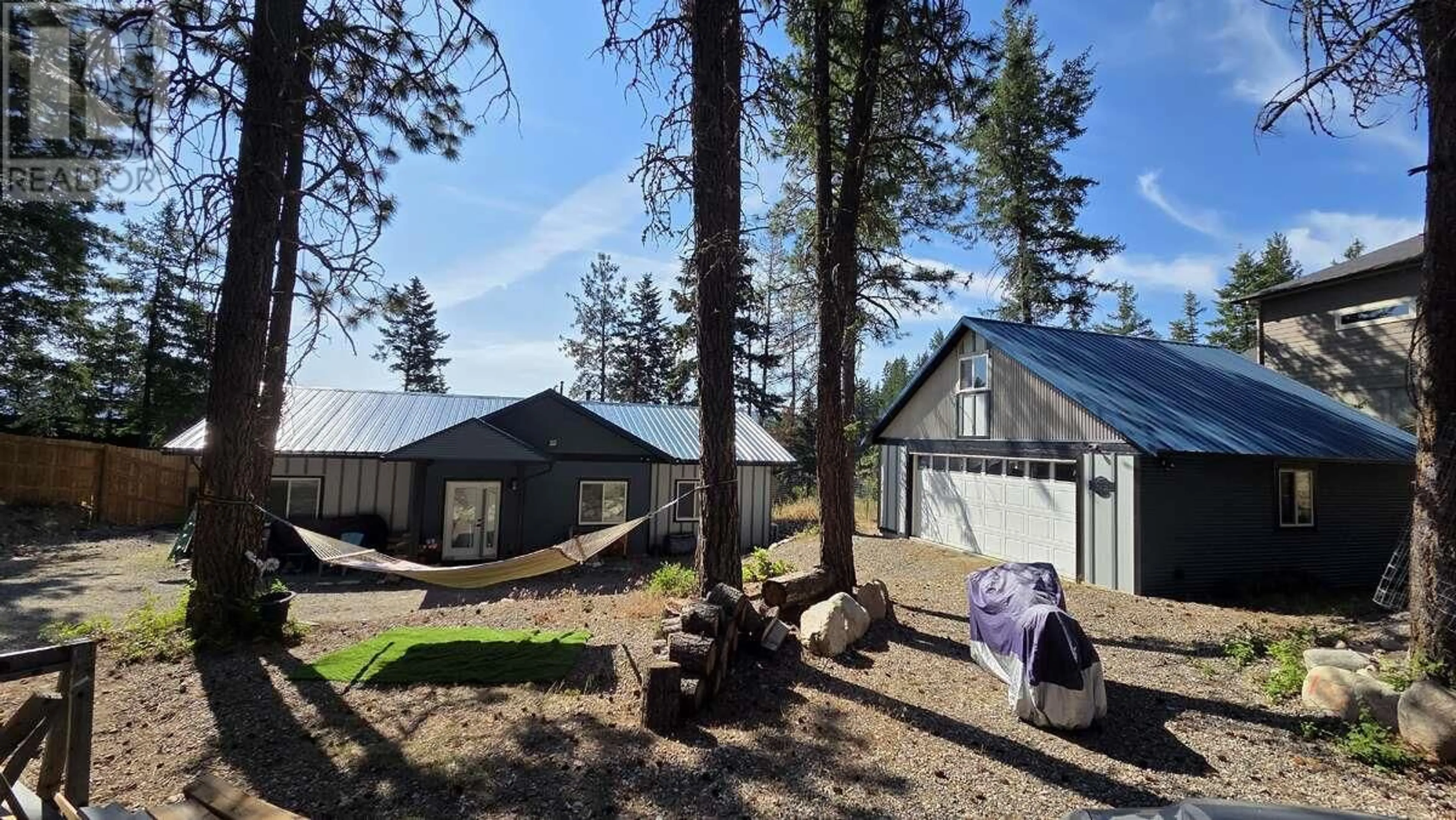A pic from outside/outdoor area/front of a property/back of a property/a pic from drone, forest/trees view for 10795 WESTSHORE ROAD, Vernon British Columbia V1H2C3