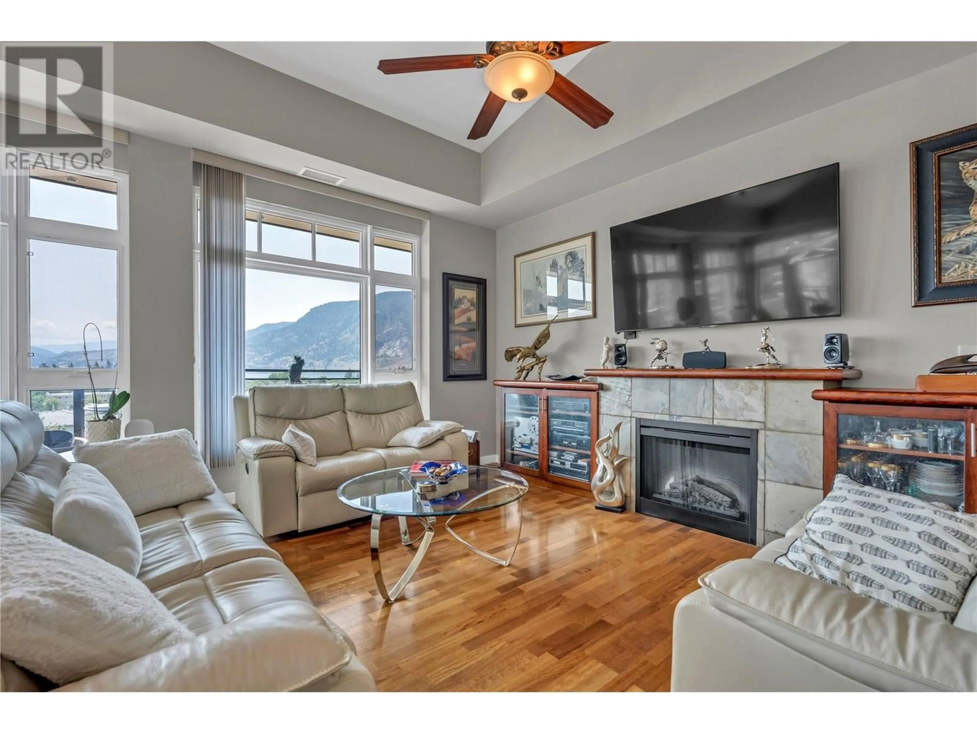Living room with furniture, wood/laminate floor for 803 - 3301 SKAHA LAKE ROAD, Penticton British Columbia V2A6G6