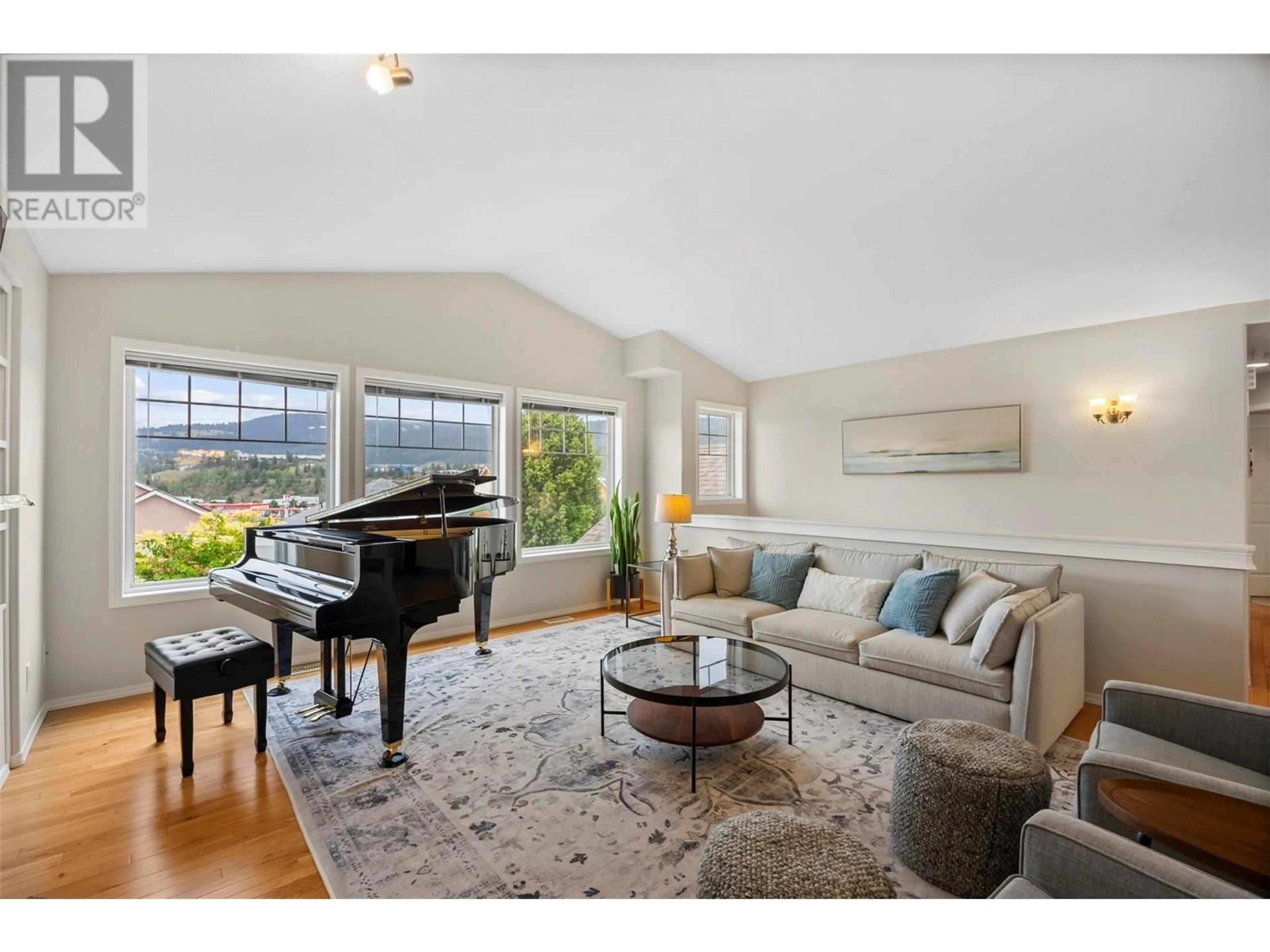 Living room with furniture, wood/laminate floor for 1983 SASKATOON PLACE, Kamloops British Columbia V2E2T1