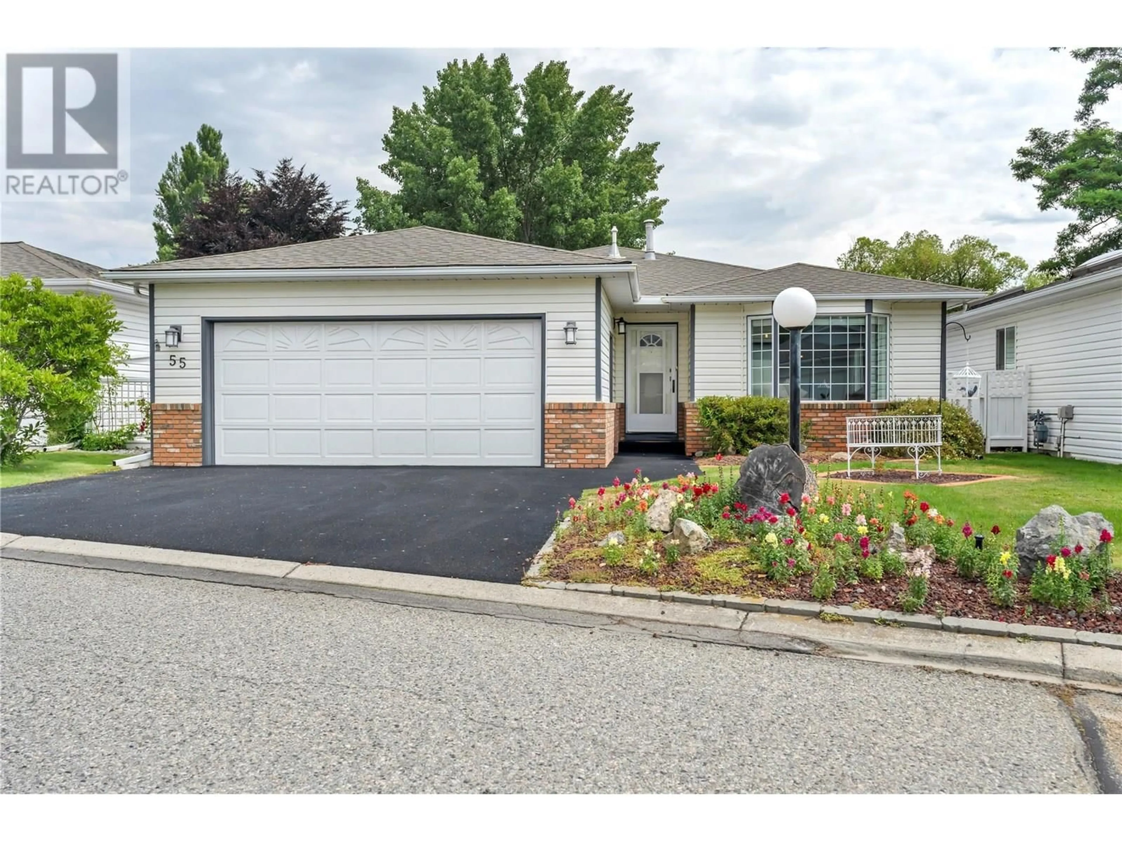 Home with vinyl exterior material, street for 55 KINGFISHER DRIVE, Penticton British Columbia V2A8K6