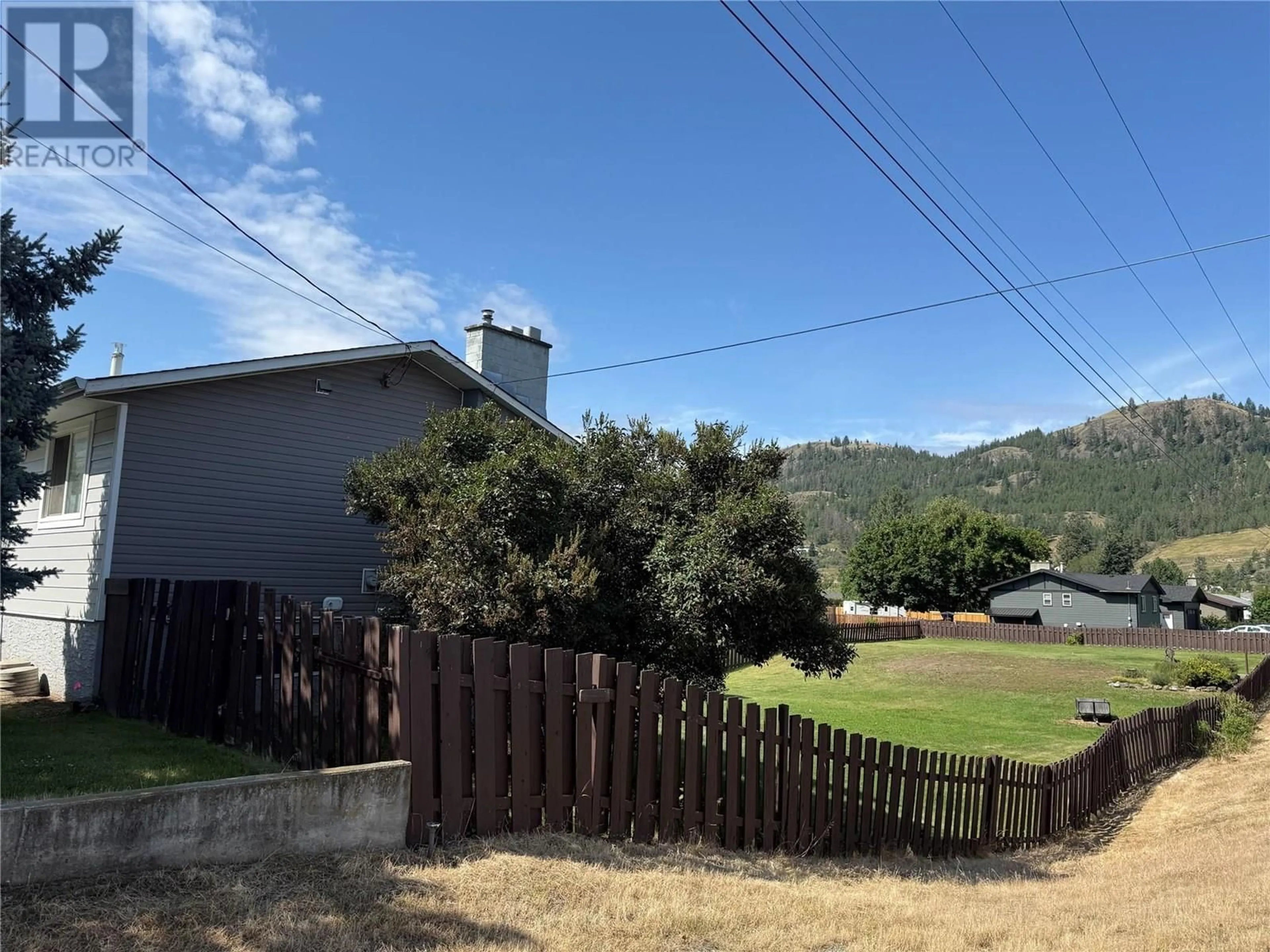 A pic from outside/outdoor area/front of a property/back of a property/a pic from drone, mountain view for 4693 SPURRAWAY ROAD, Kamloops British Columbia V2H1M7