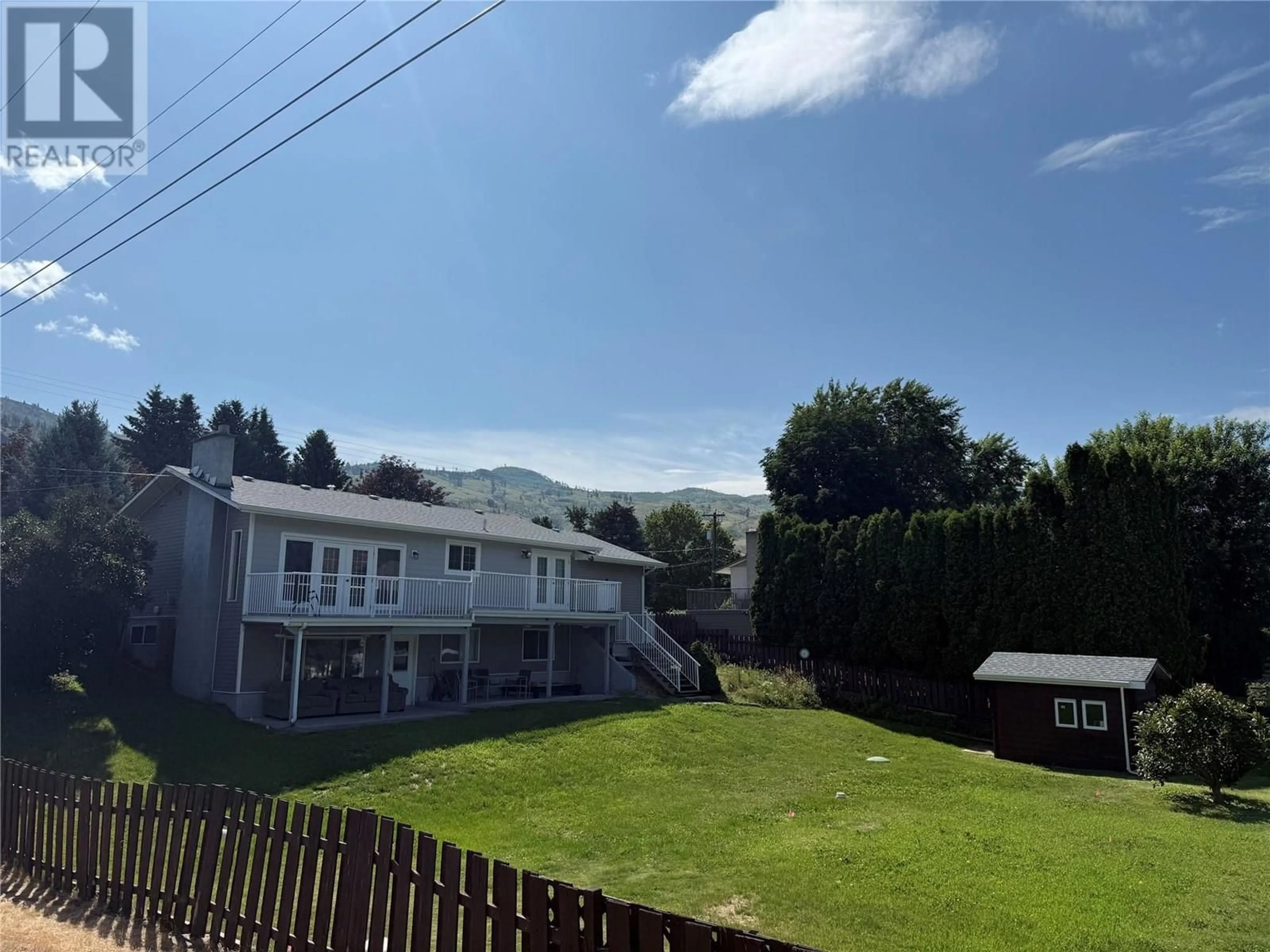 A pic from outside/outdoor area/front of a property/back of a property/a pic from drone, mountain view for 4693 SPURRAWAY ROAD, Kamloops British Columbia V2H1M7