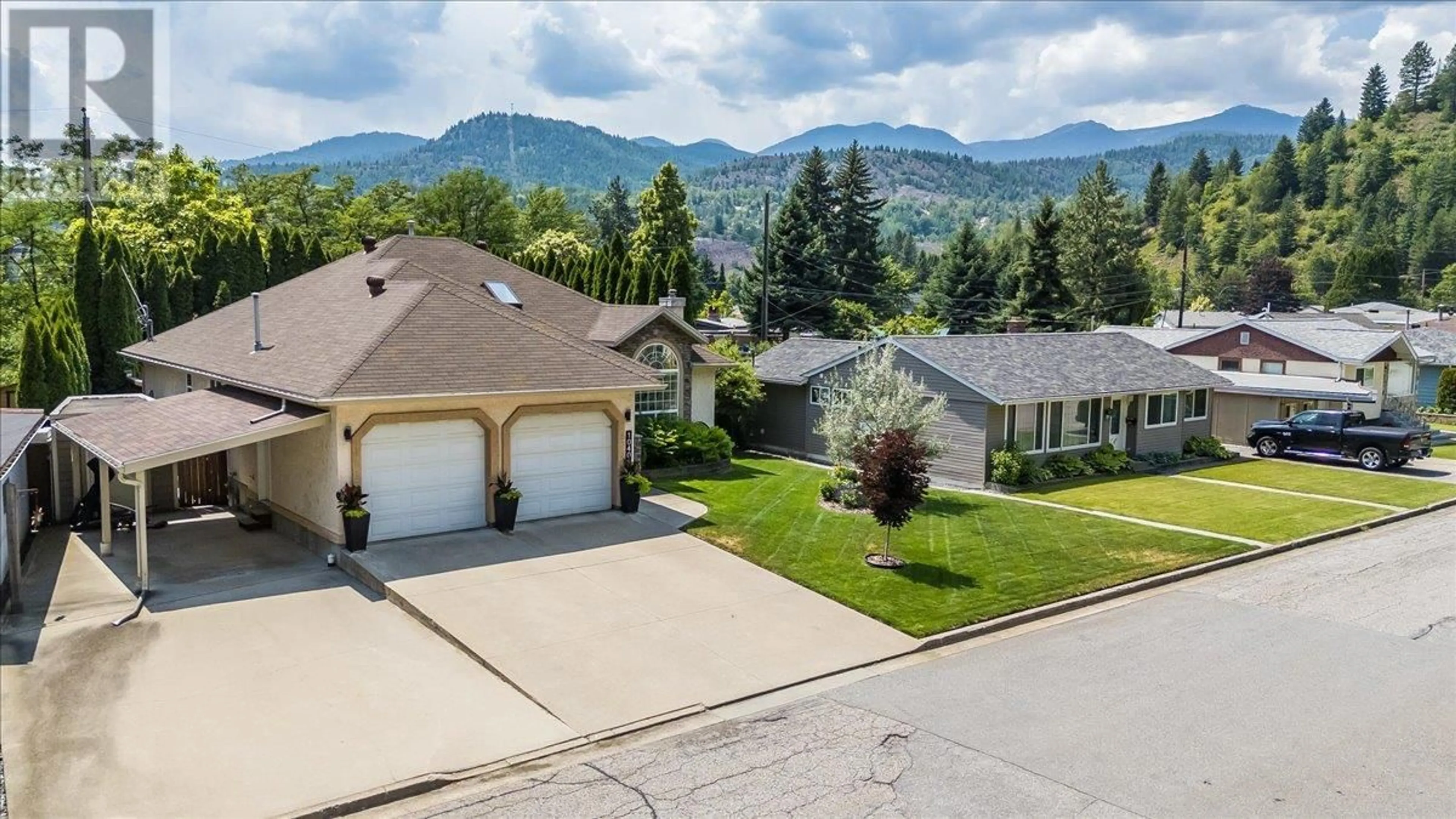 A pic from outside/outdoor area/front of a property/back of a property/a pic from drone, mountain view for 1040 REGAN CRESCENT, Trail British Columbia V1R1C4