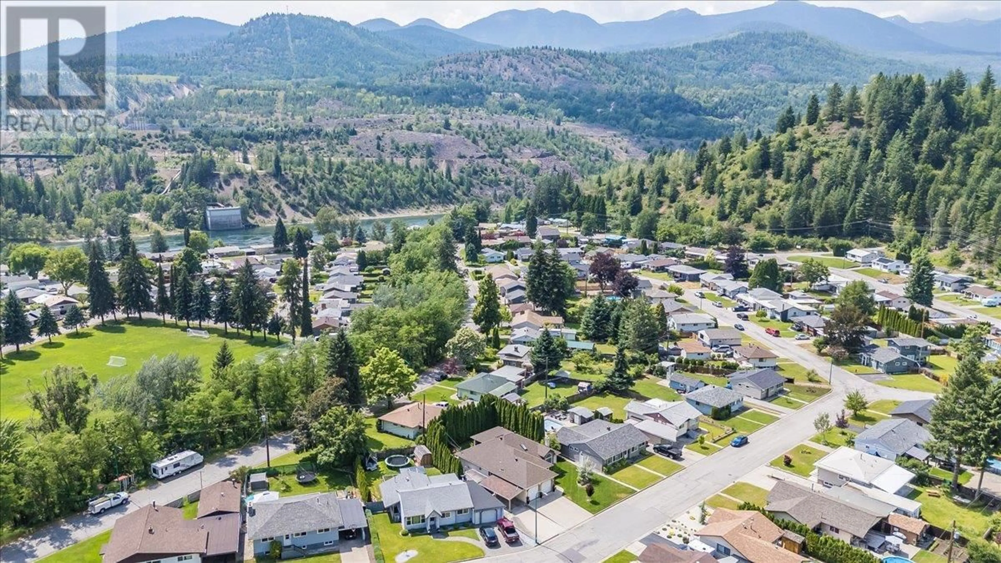A pic from outside/outdoor area/front of a property/back of a property/a pic from drone, mountain view for 1040 REGAN CRESCENT, Trail British Columbia V1R1C4