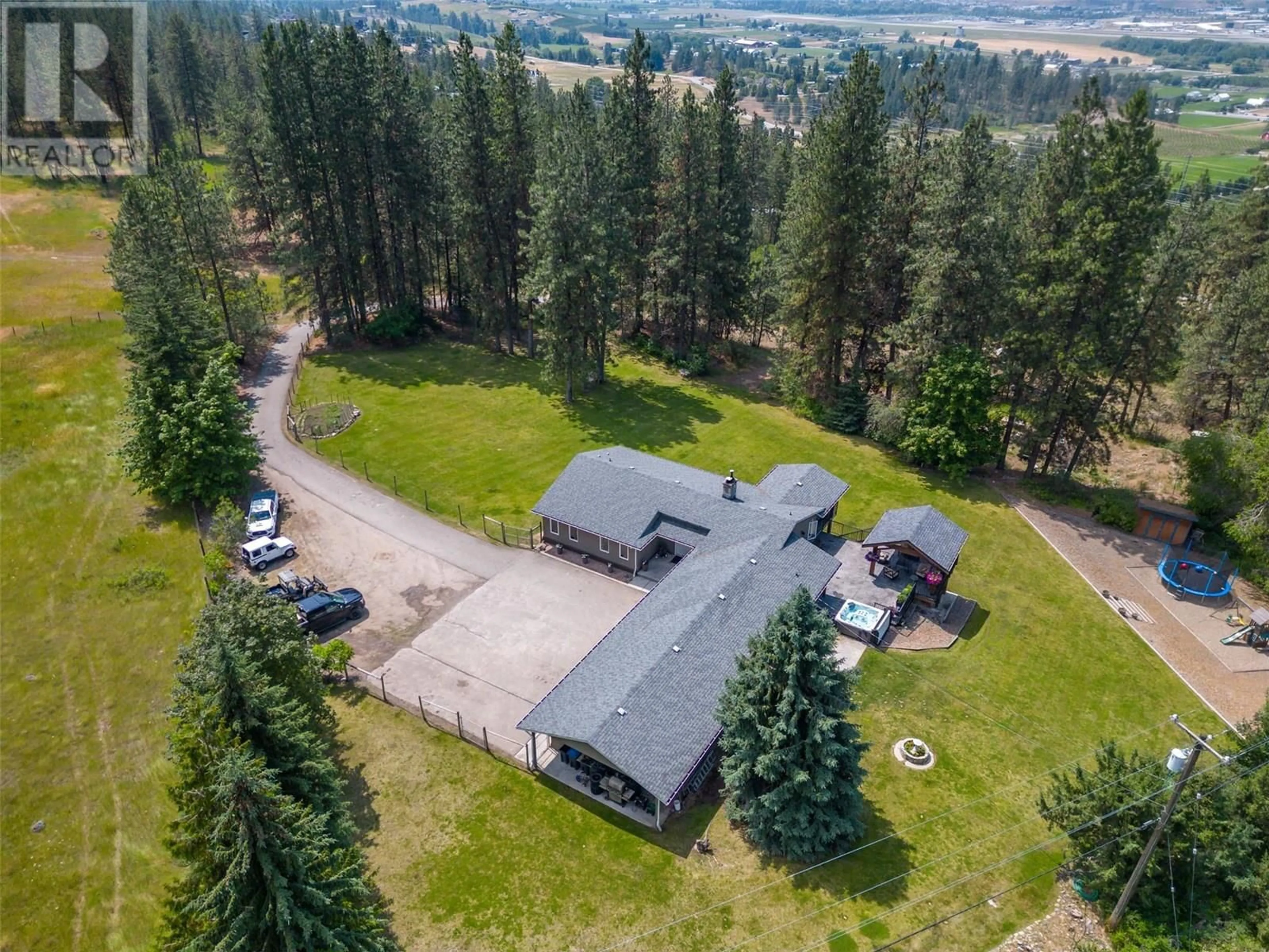 A pic from outside/outdoor area/front of a property/back of a property/a pic from drone, mountain view for 6051 POSTILL LAKE ROAD, Kelowna British Columbia V1X7V3