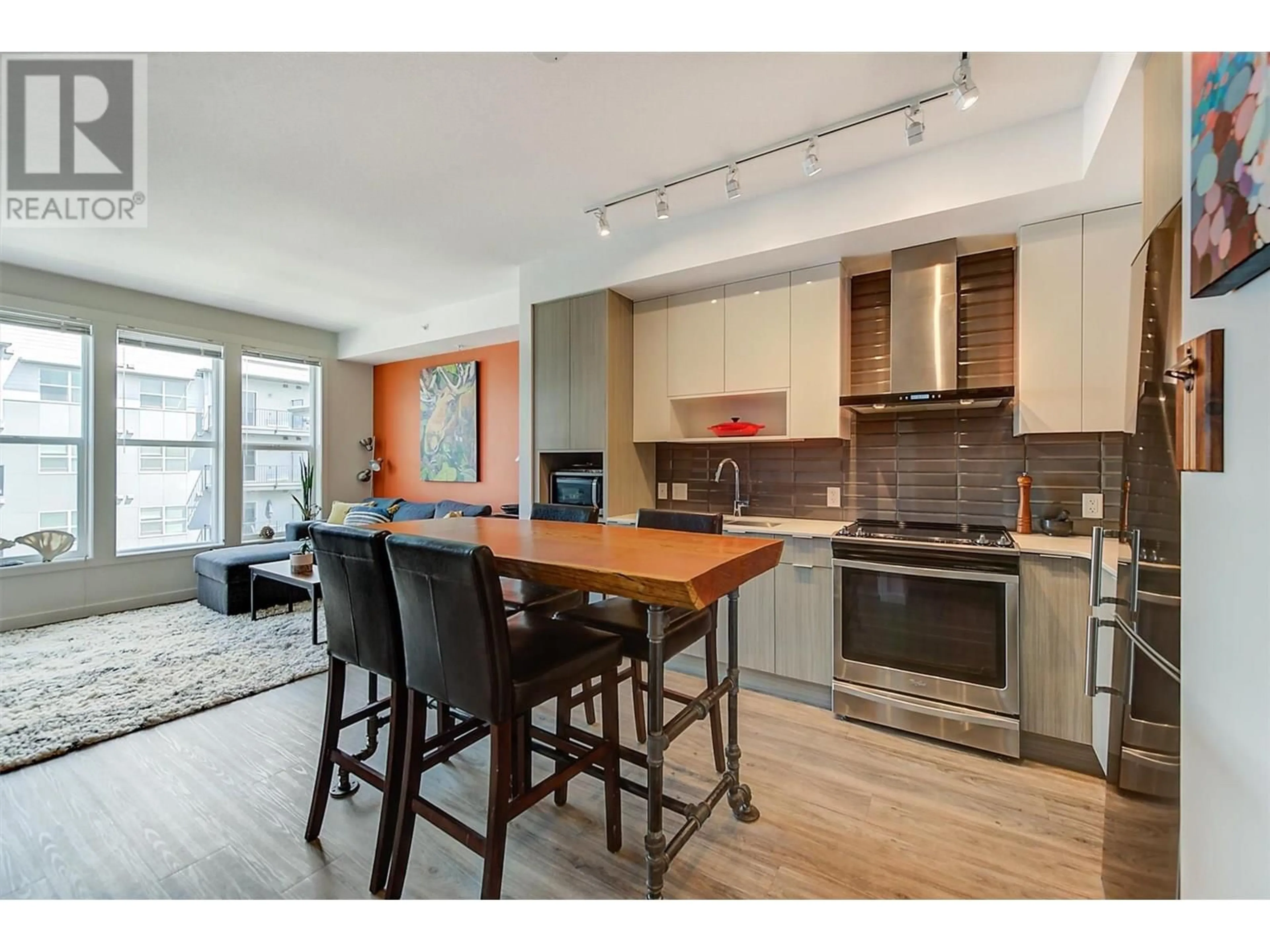 Open concept kitchen, wood/laminate floor for PH12 - 1775 CHAPMAN PLACE, Kelowna British Columbia V1Y0G3