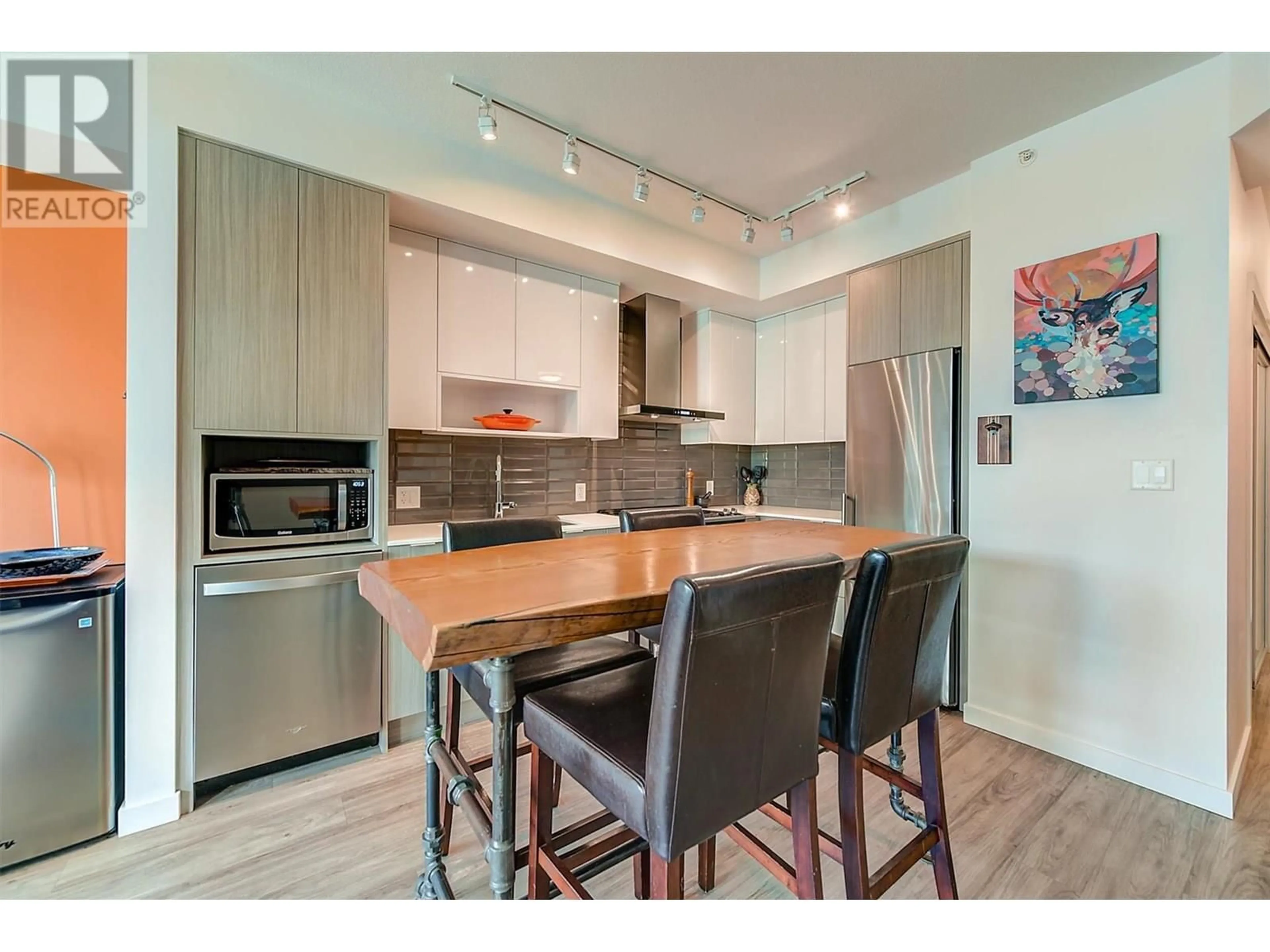Open concept kitchen, wood/laminate floor for PH12 - 1775 CHAPMAN PLACE, Kelowna British Columbia V1Y0G3