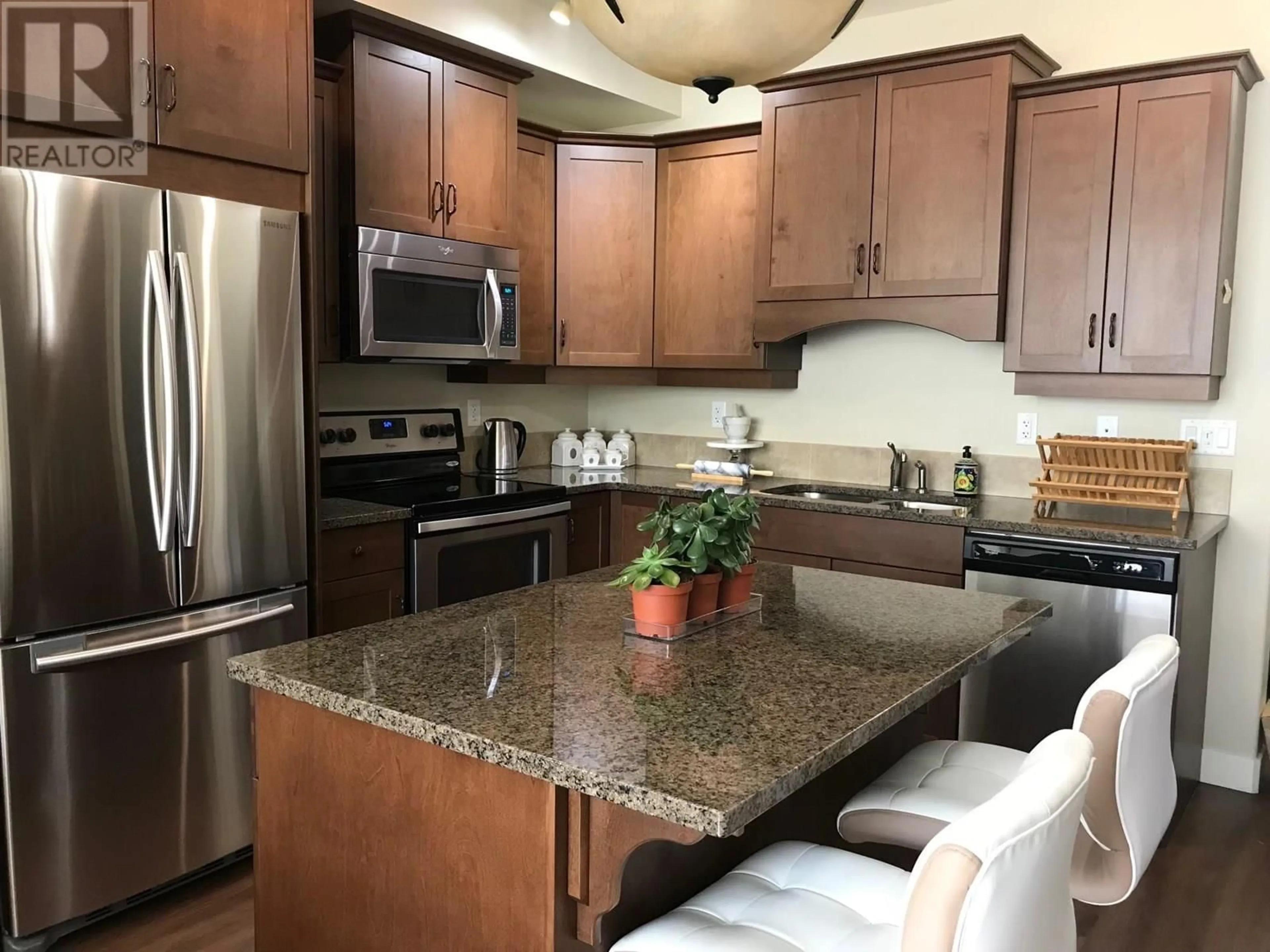 Open concept kitchen, ceramic/tile floor for 407 - 755 MCGILL ROAD, Kamloops British Columbia V2C0B6
