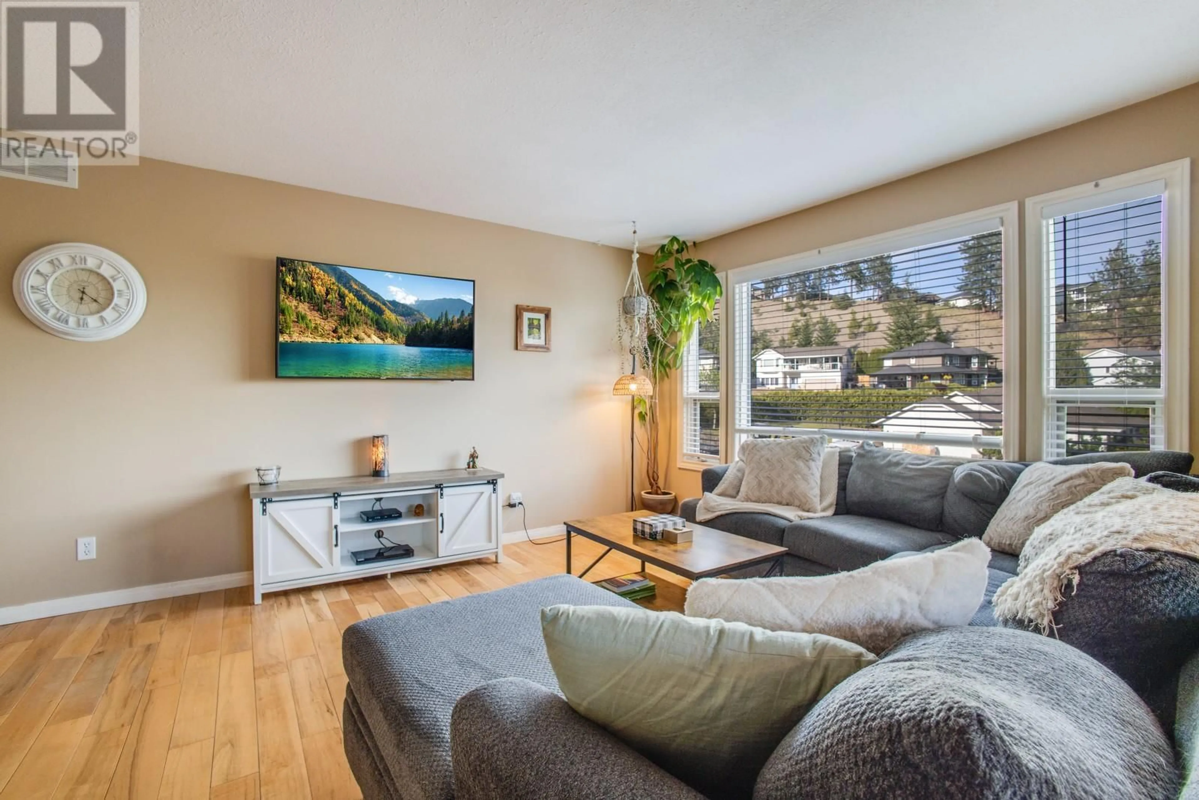 Living room with furniture, wood/laminate floor for 3166 BROADVIEW PLACE, West Kelowna British Columbia V4T1M9
