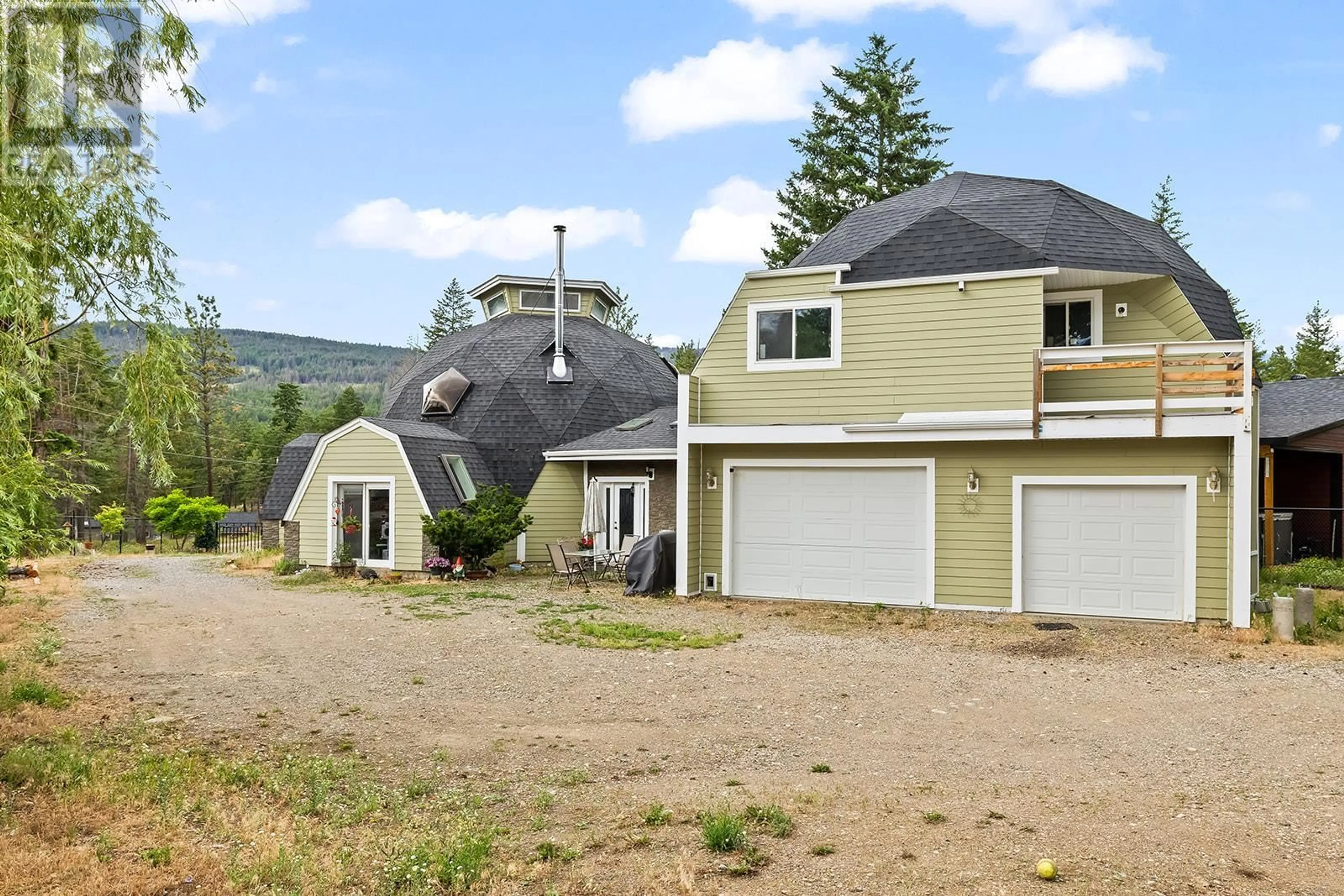 A pic from outside/outdoor area/front of a property/back of a property/a pic from drone, mountain view for 7172 DUNWATERS ROAD, Kelowna British Columbia V1Z3W5